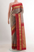 Grey Kanchipuram Silk Saree with Zari Brocade on the body and Zari Border.  displayed on a mannequin