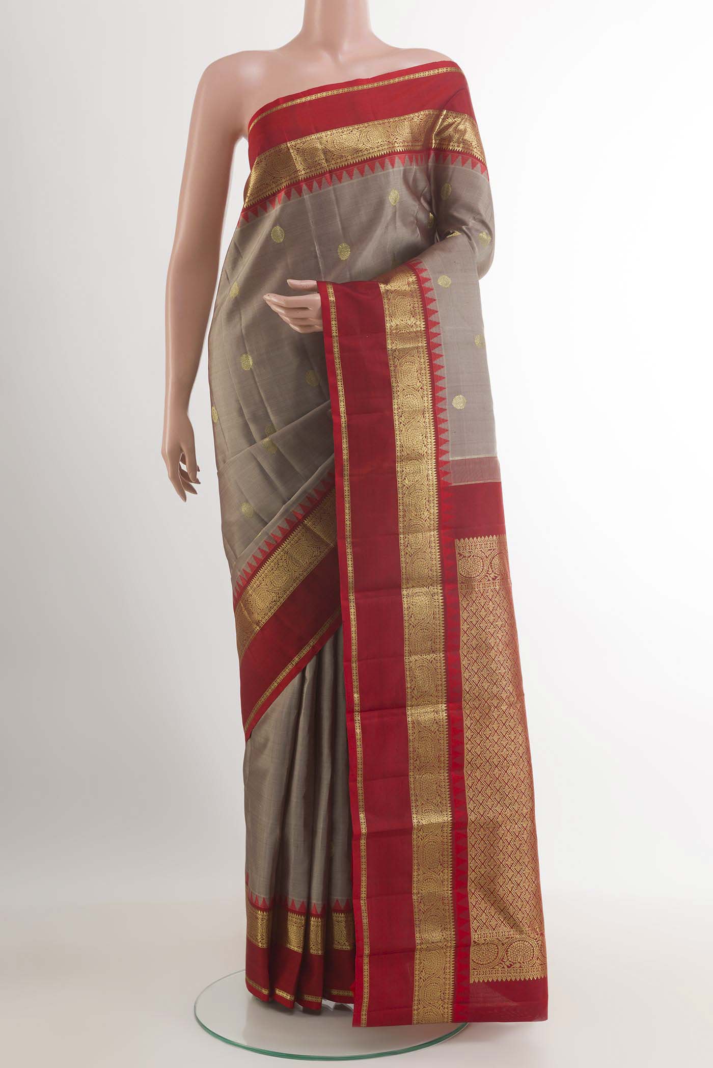 Grey Kanchipuram Silk Saree with Zari Brocade on the body and Zari Border.  displayed on a mannequin