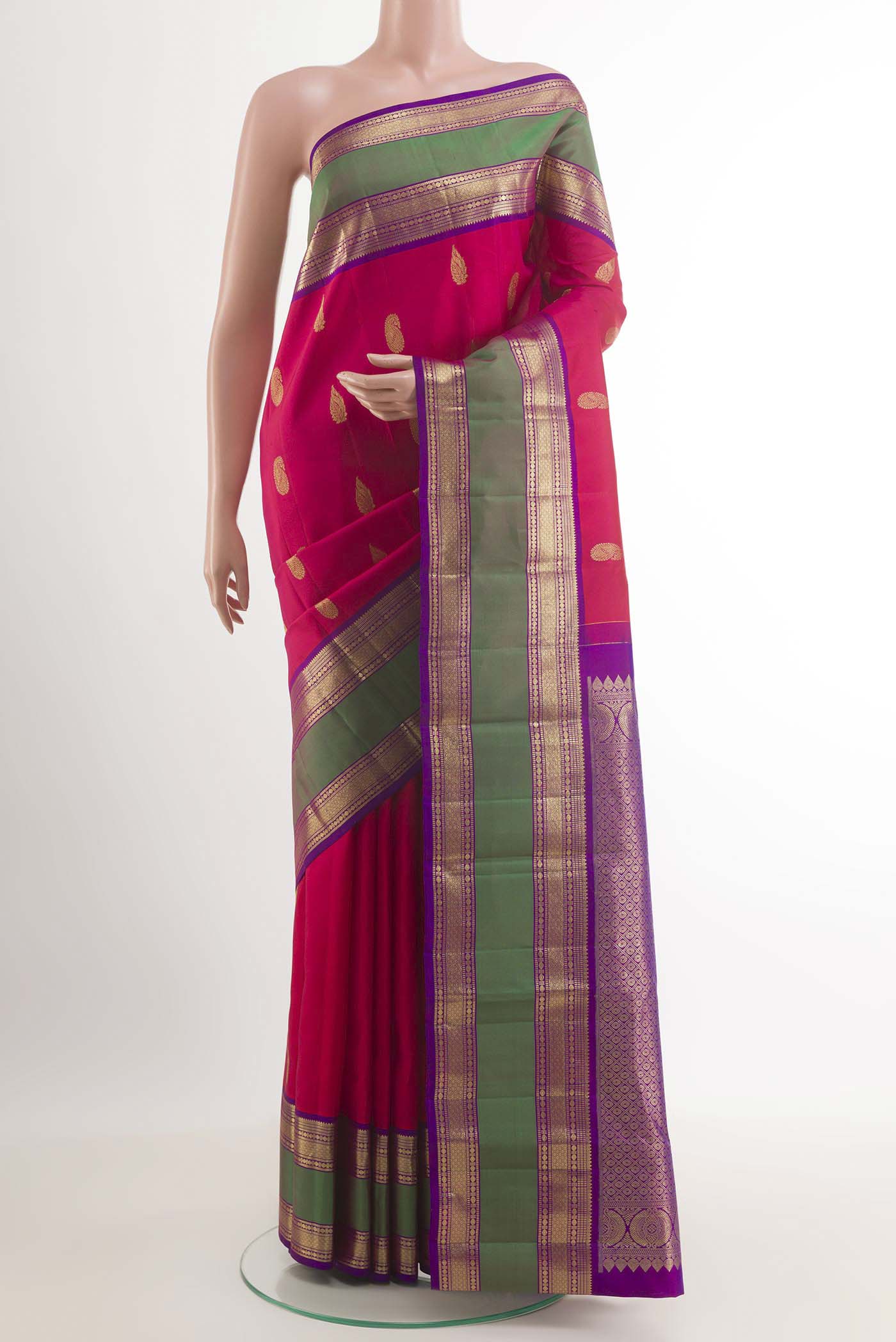 Pink Kanchipuram Silk Saree with Zari Butta on the body and Zari Border.  displayed on a mannequin