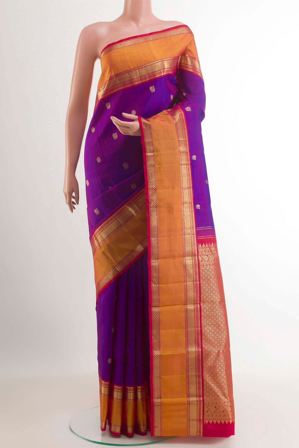 Purple Kanchipuram Silk Saree with Zari Butta on the body and Zari Border.  displayed on a mannequin