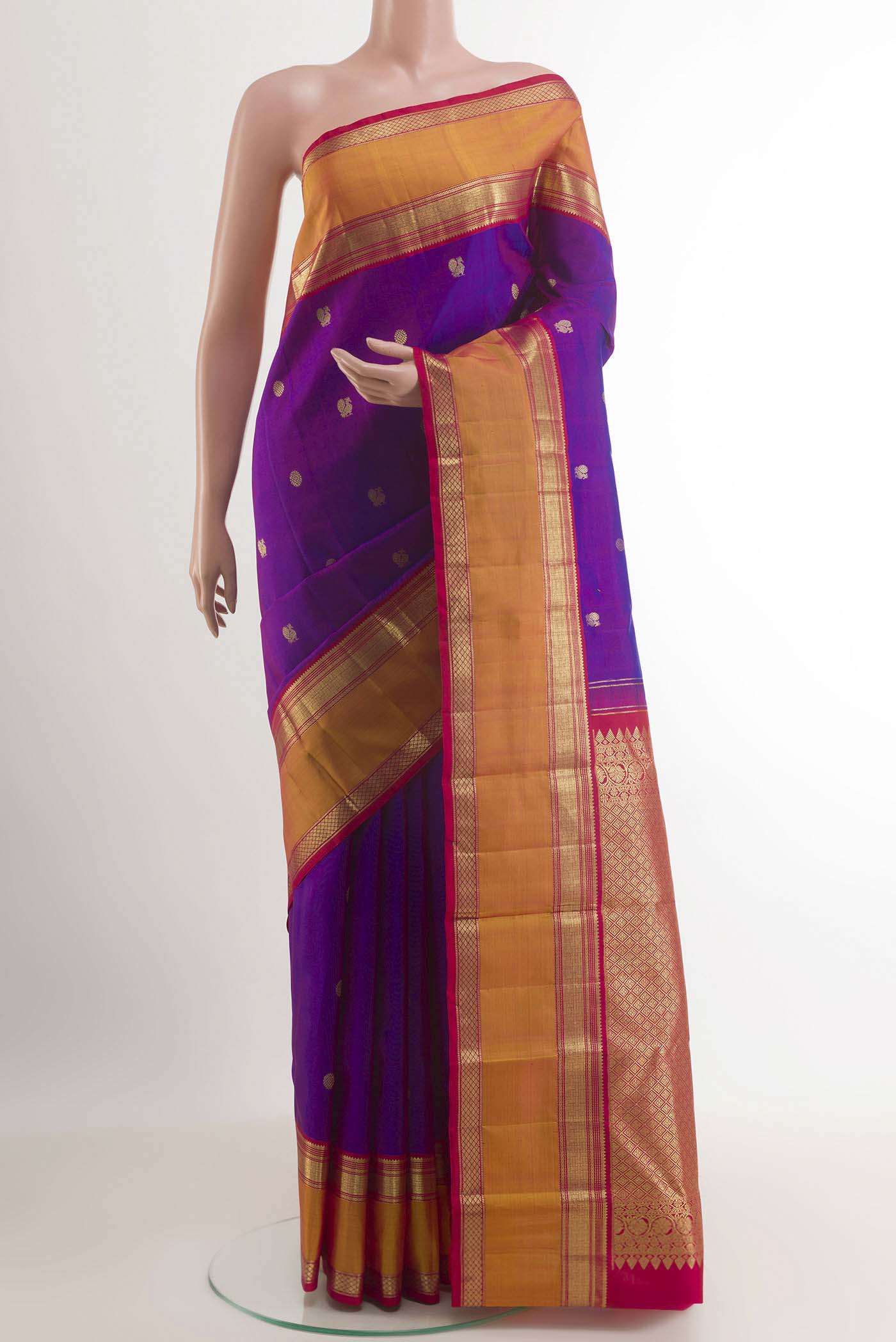 Purple Kanchipuram Silk Saree with Zari Butta on the body and Zari Border.  displayed on a mannequin