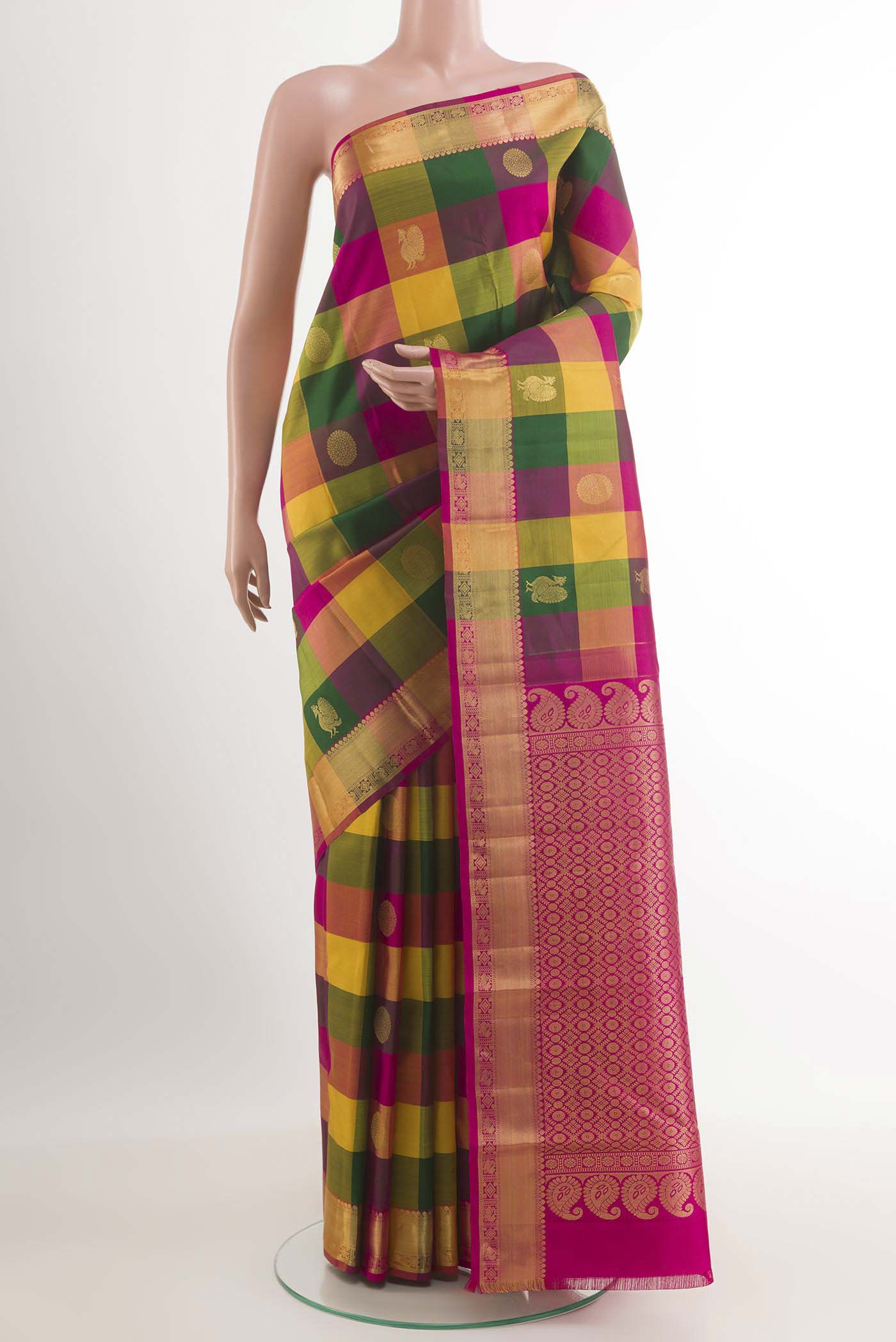 Multi Color Kanchipuram Silk Saree with Checked design on the body and Zari Border.  displayed on a mannequin