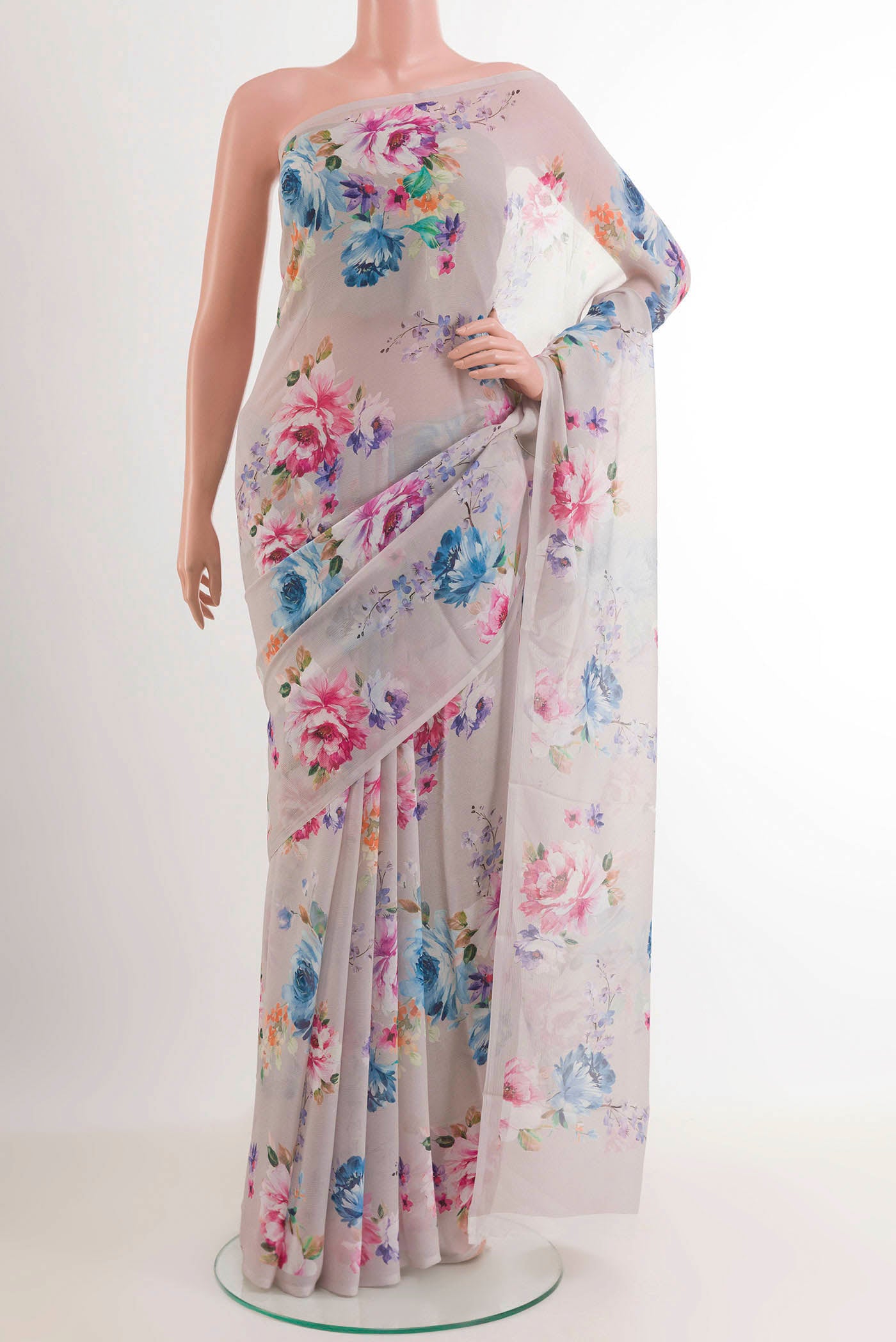 Off White Chiffon Saree with Printed design on the body and Plain Border.  displayed on a mannequin