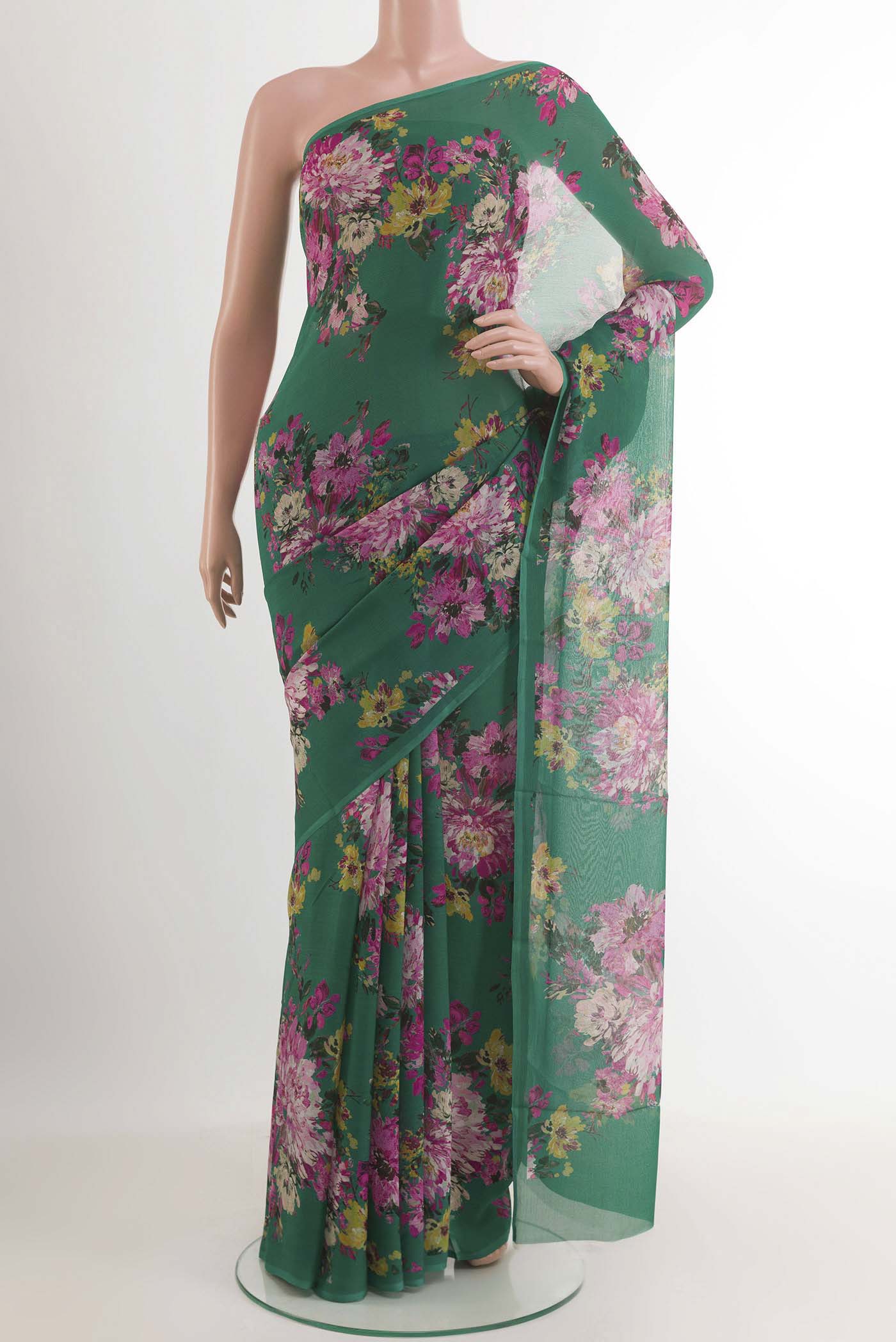 Green Chiffon Saree with Printed design on the body and Plain Border.  displayed on a mannequin
