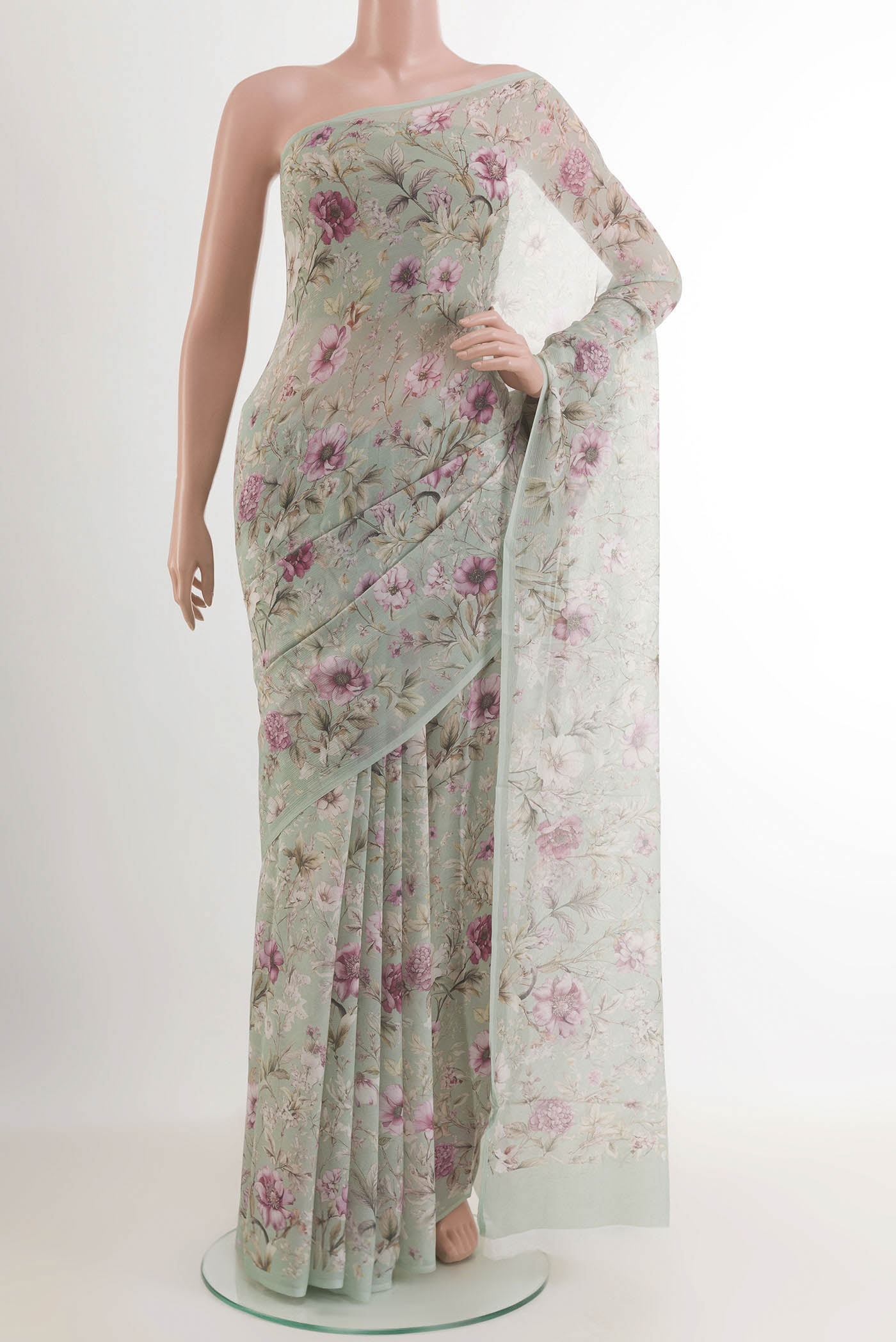 Blue Chiffon Saree with Printed design on the body and Plain Border.  displayed on a mannequin