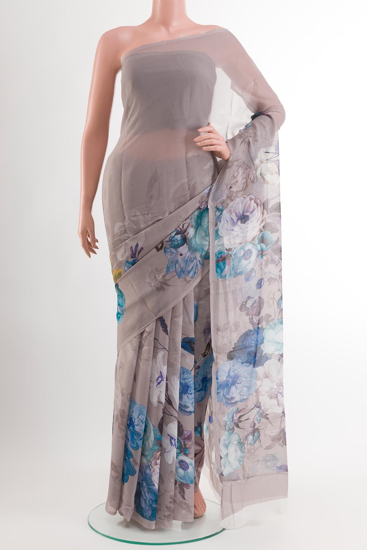 Grey Chiffon Saree with Printed design on the body and Plain Border.  displayed on a mannequin