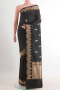 Black Banarasi Katan Silk Saree with Zari Butta on the body and Zari Border.  displayed on a mannequin