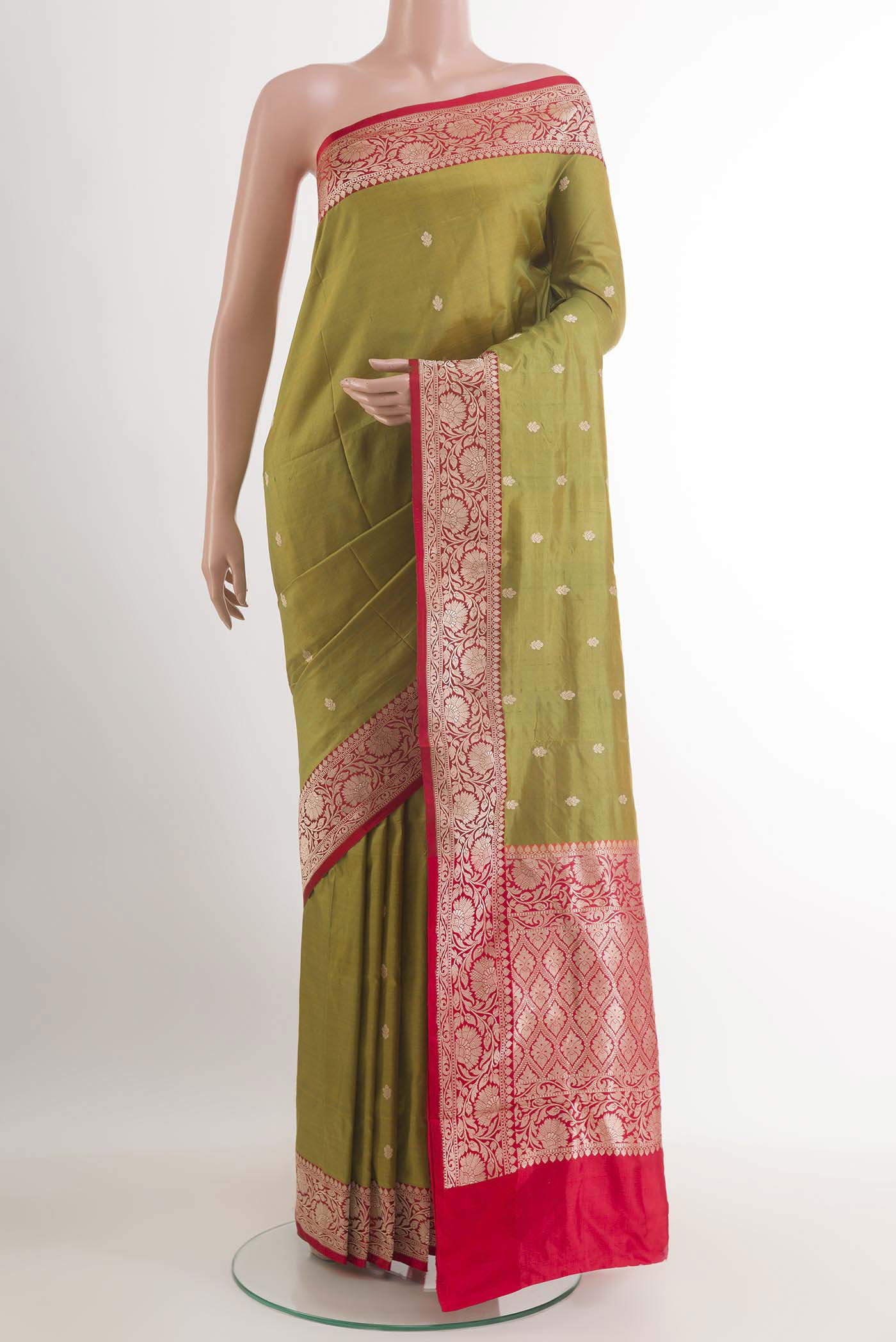 Mehandi Green Banarasi Katan Silk Saree with Zari Butta on the body and Zari Border.  displayed on a mannequin