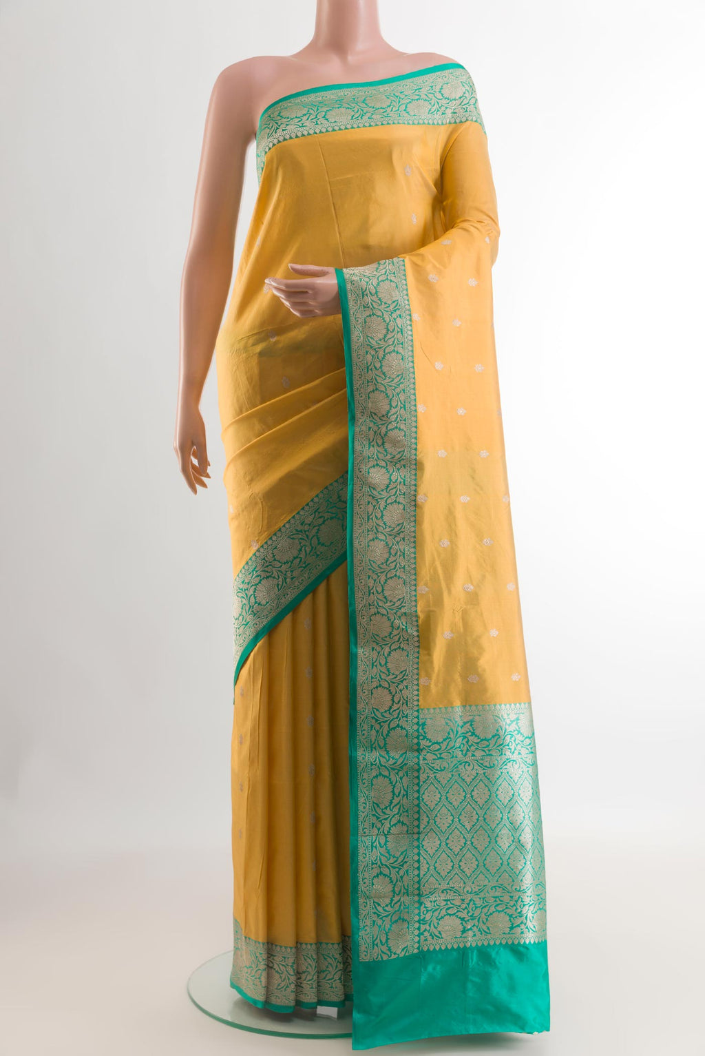 Yellow Banarasi Katan Silk Saree with Zari Butta on the body and Zari Border.  displayed on a mannequin