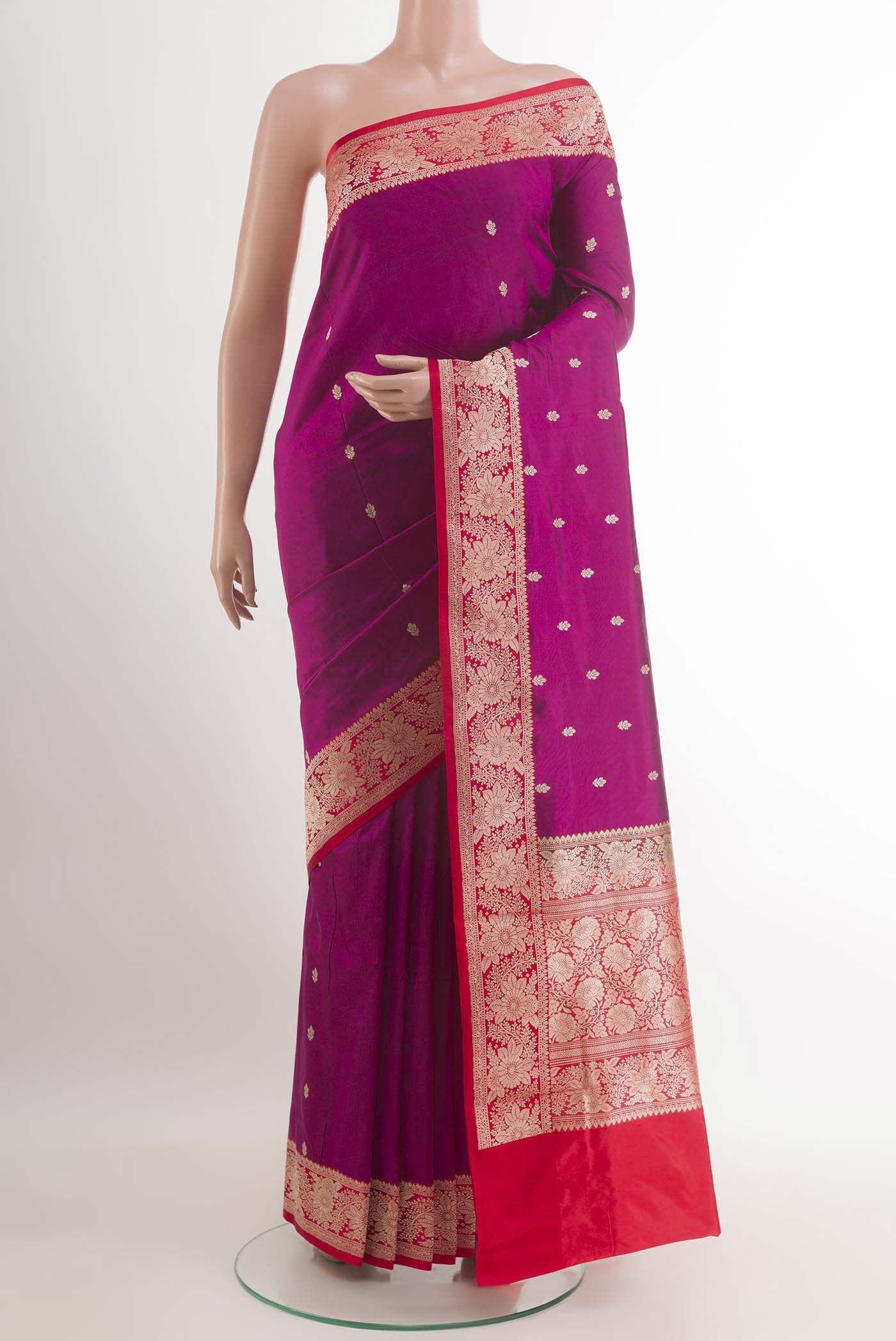 Rani Pink Banarasi Katan Silk Saree with Zari Butta on the body and Zari Border.  displayed on a mannequin