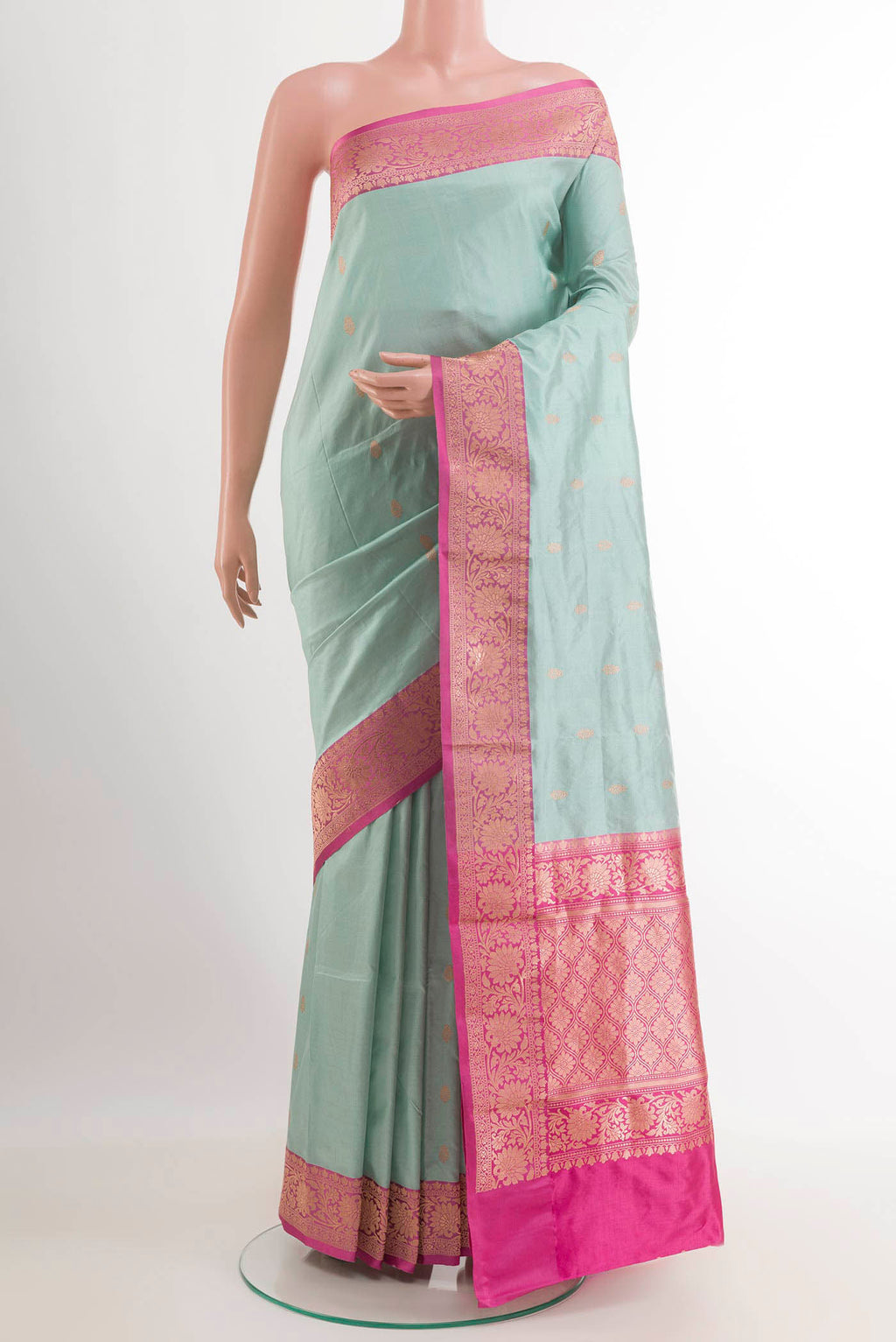 Sky Blue Banarasi Katan Silk Saree with Zari Butta on the body and Zari Border.  displayed on a mannequin