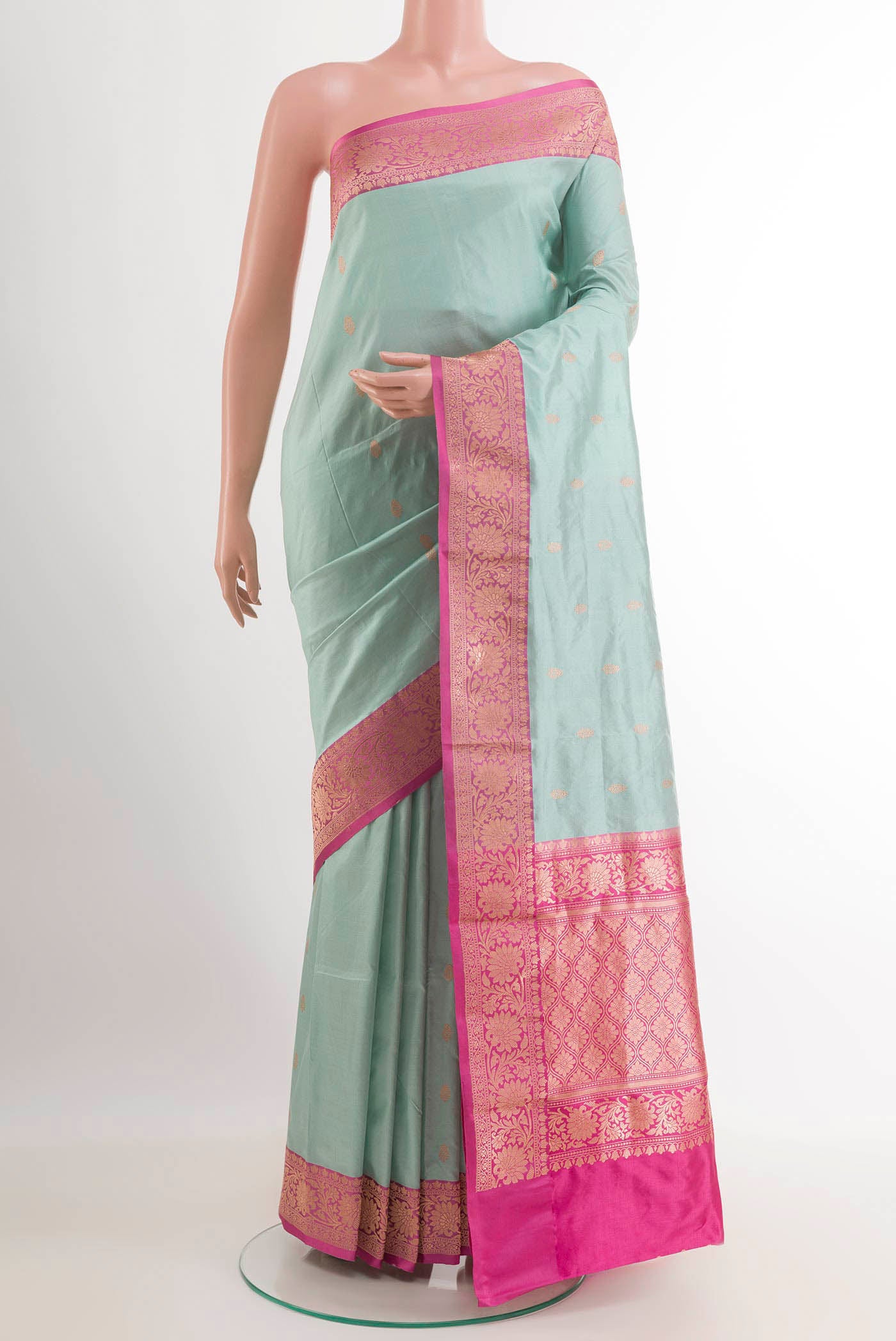Sky Blue Banarasi Katan Silk Saree with Zari Butta on the body and Zari Border.  displayed on a mannequin
