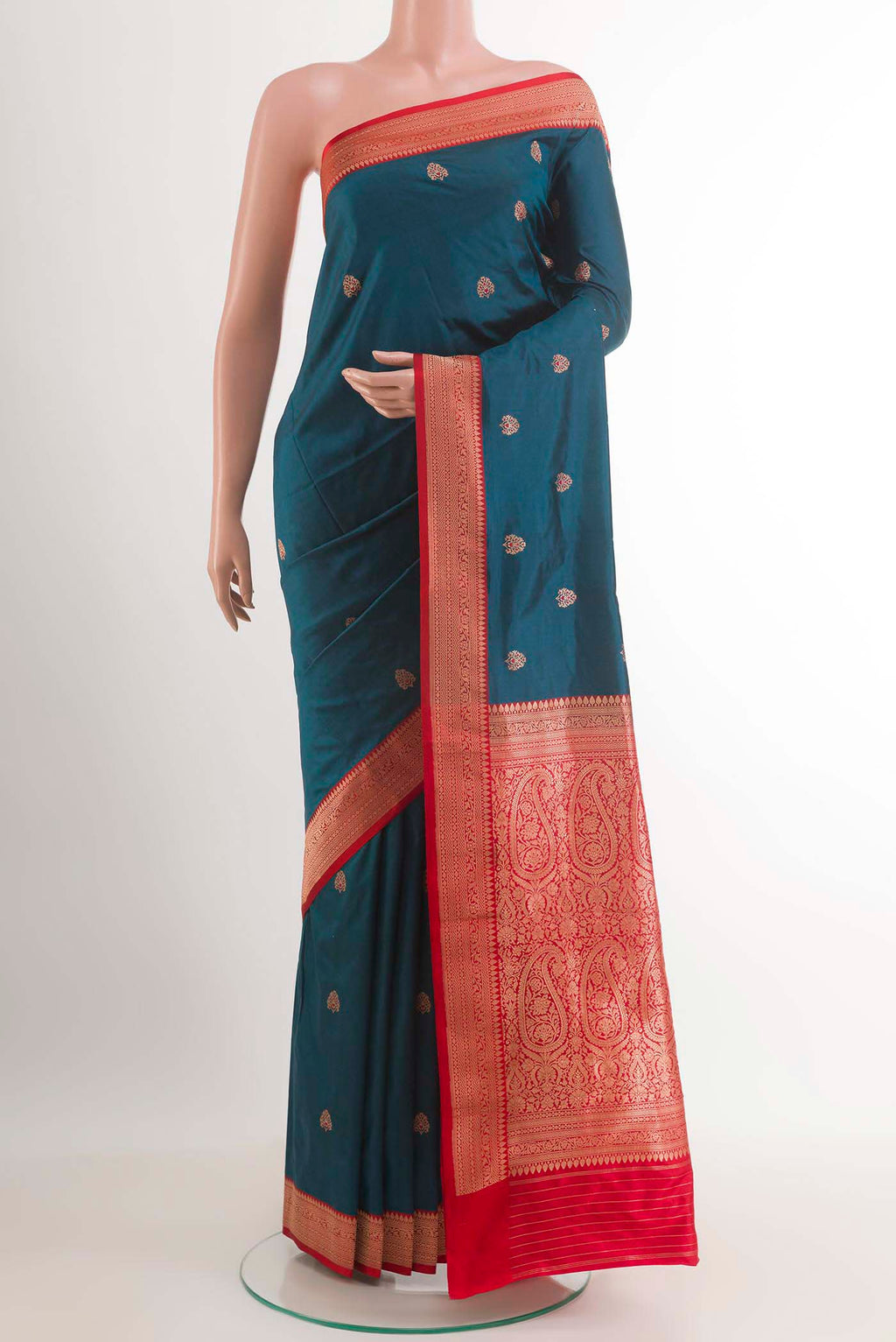 Royal Blue Banarasi Katan Silk Saree with Zari Butta on the body and Zari Border.  displayed on a mannequin
