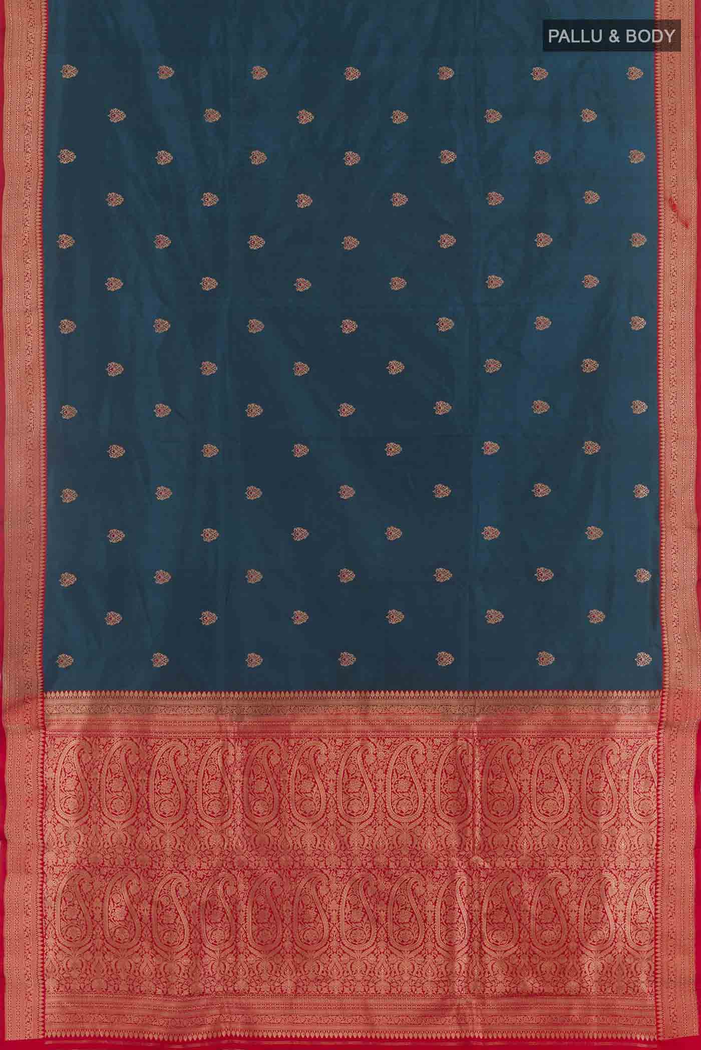 Flat view of Royal Blue Banarasi Katan Silk Saree with Zari Butta on the body and Zari Border. 