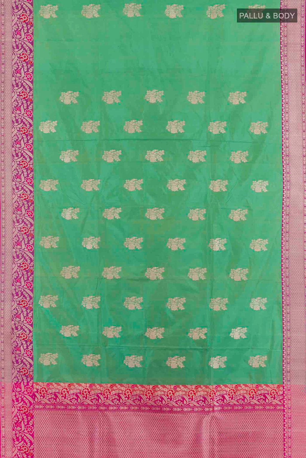 Flat view of Green Banarasi Silk Saree with Zari Butta on the body and Zari Border. 