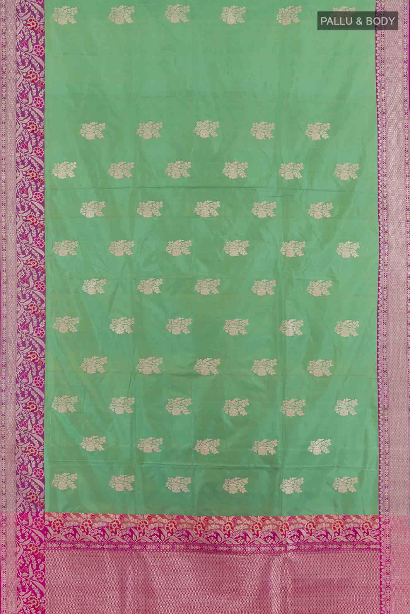 Flat view of Green Banarasi Silk Saree with Zari Butta on the body and Zari Border. 