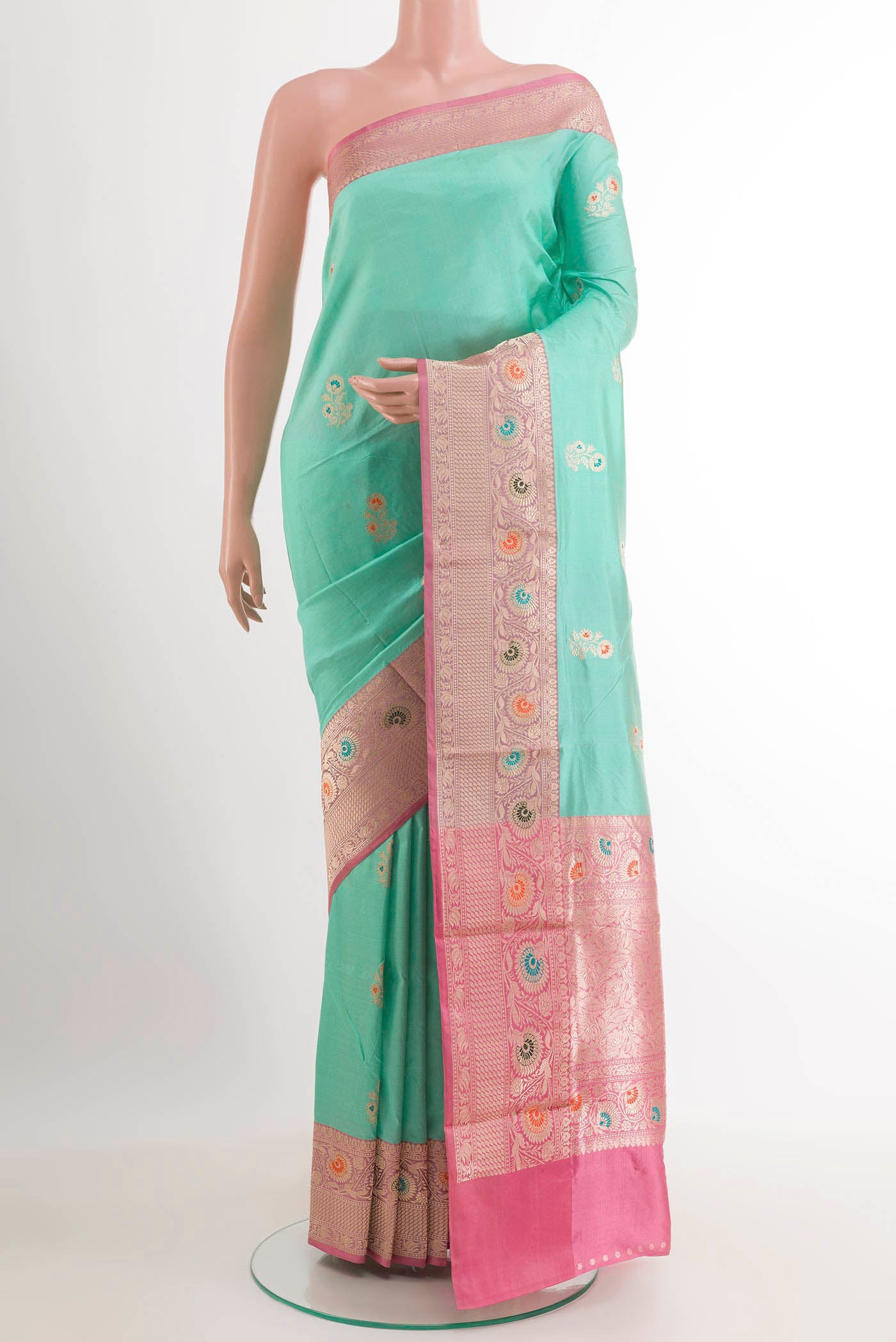 Turquoise Banarasi Katan Silk Saree with Zari Butta on the body and Zari Border.  displayed on a mannequin