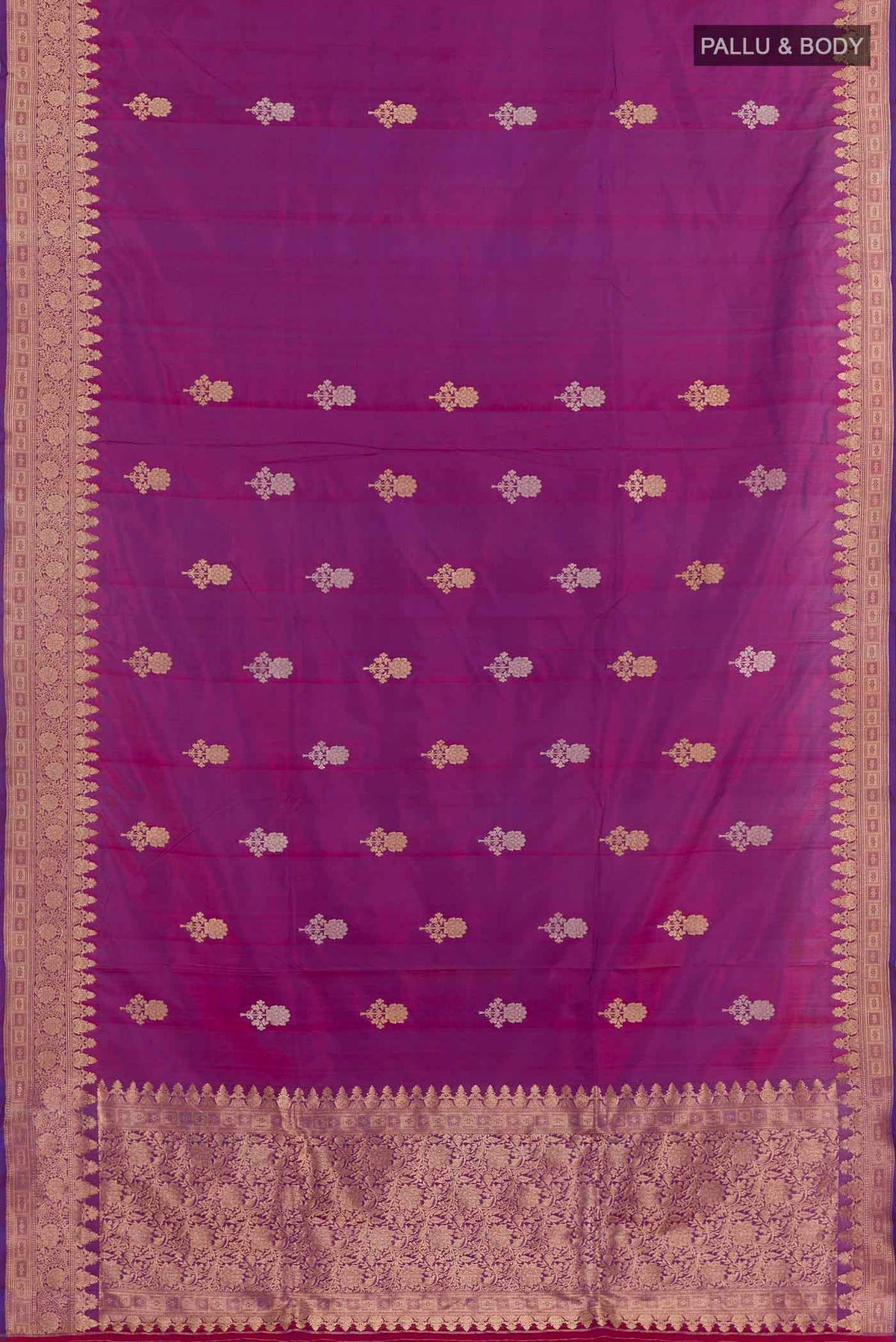 Flat view of Purple Banarasi Katan Silk Saree with Zari Butta on the body and Zari Border. 