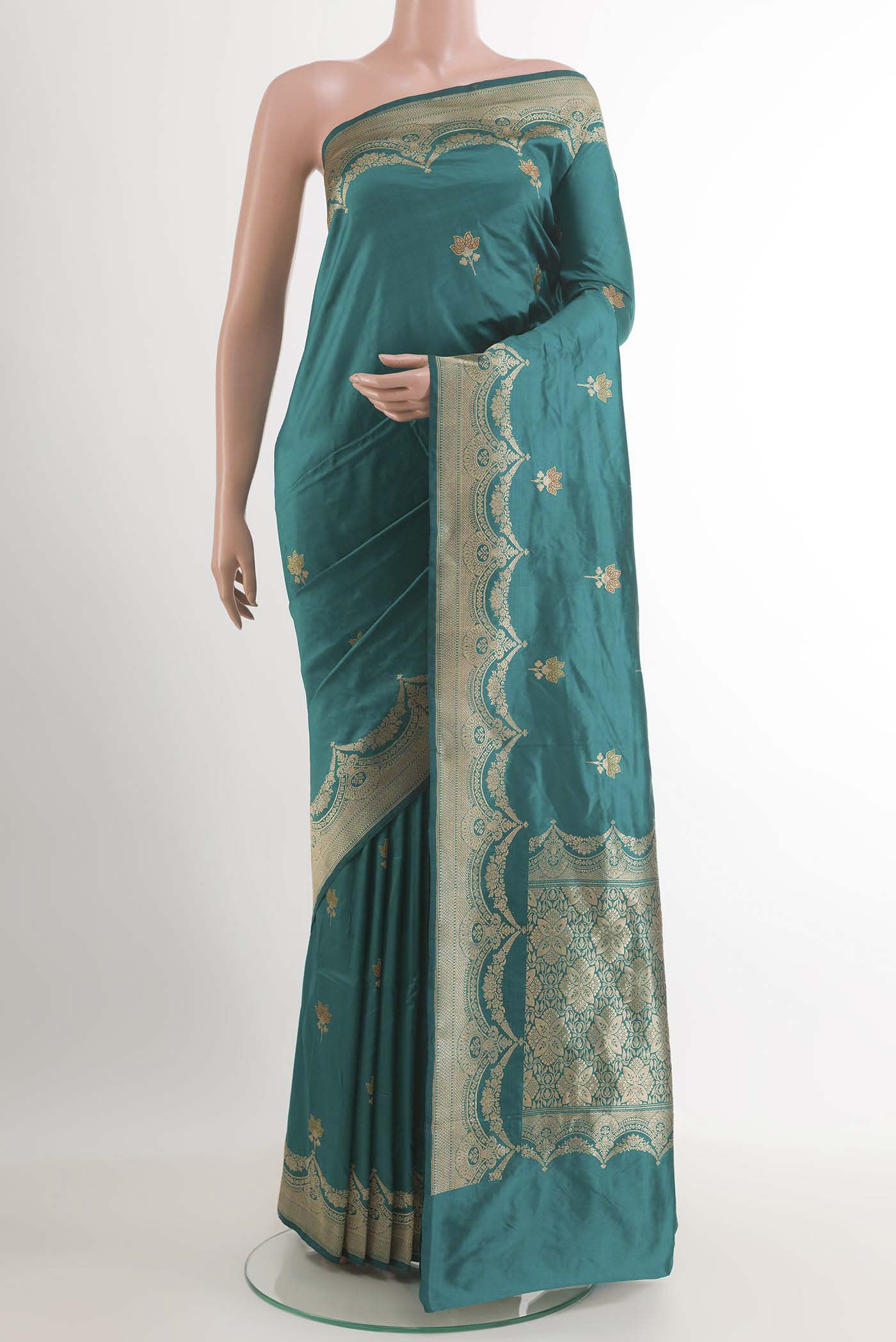 Teal Banarasi Katan Silk Saree with Zari Butta on the body and Zari Border.  displayed on a mannequin