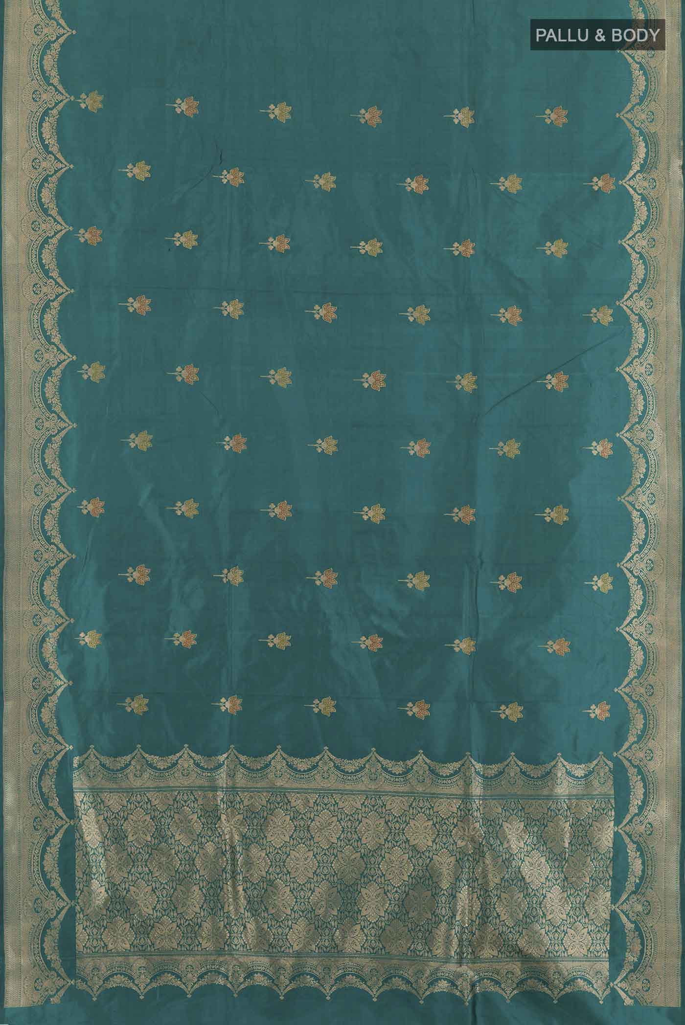 Flat view of Teal Banarasi Katan Silk Saree with Zari Butta on the body and Zari Border. 