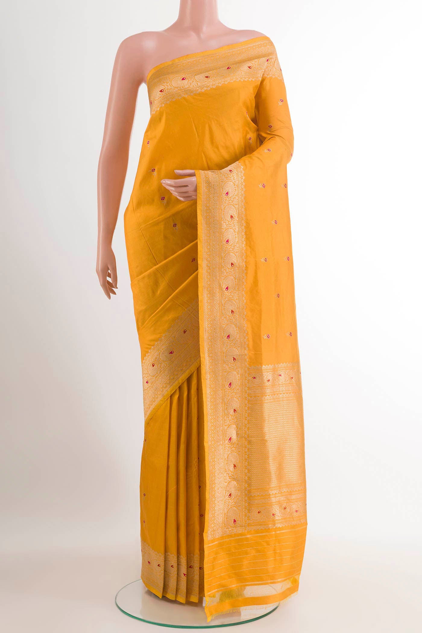 Yellow Banarasi Katan Silk Saree with Zari Butta on the body and Zari Border.  displayed on a mannequin
