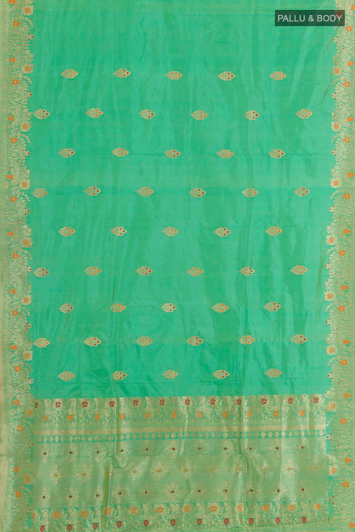 Flat view of Green Banarasi Katan Silk Saree with Zari Butta on the body and Zari Border. 