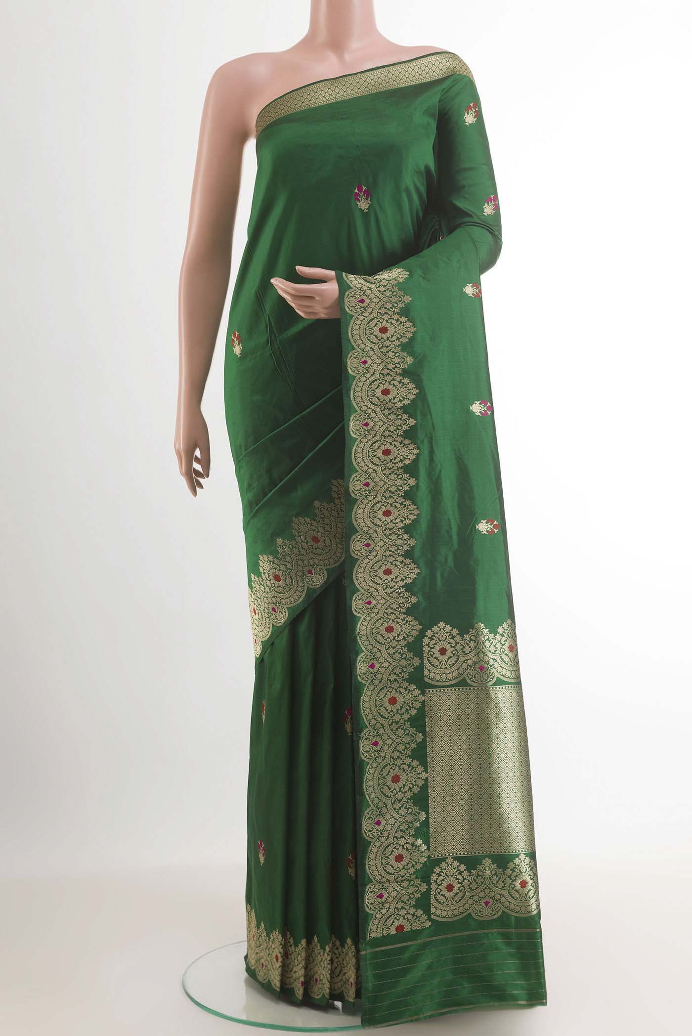 Green Banarasi Katan Silk Saree with Zari Butta on the body and Zari Border.  displayed on a mannequin