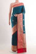 Royal Blue Banarasi Katan Silk Saree with Zari Butta on the body and Zari Border.  displayed on a mannequin