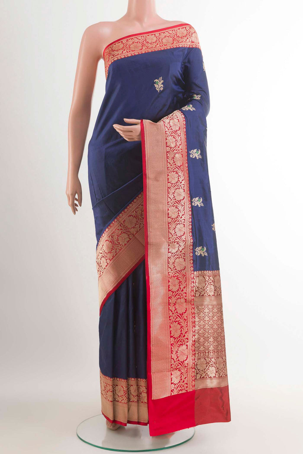 Royal Blue Banarasi Katan Silk Saree with Zari Butta on the body and Zari Border.  displayed on a mannequin