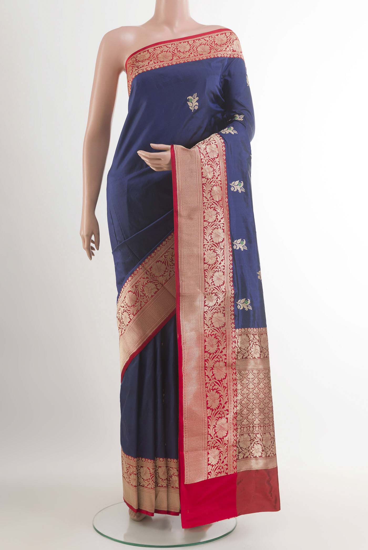Royal Blue Banarasi Katan Silk Saree with Zari Butta on the body and Zari Border.  displayed on a mannequin