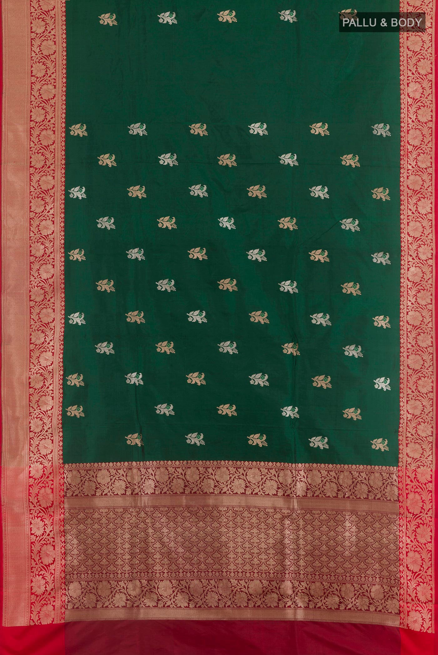 Flat view of Bottle Green Banarasi Katan Silk Saree with Zari Butta on the body and Zari Border. 