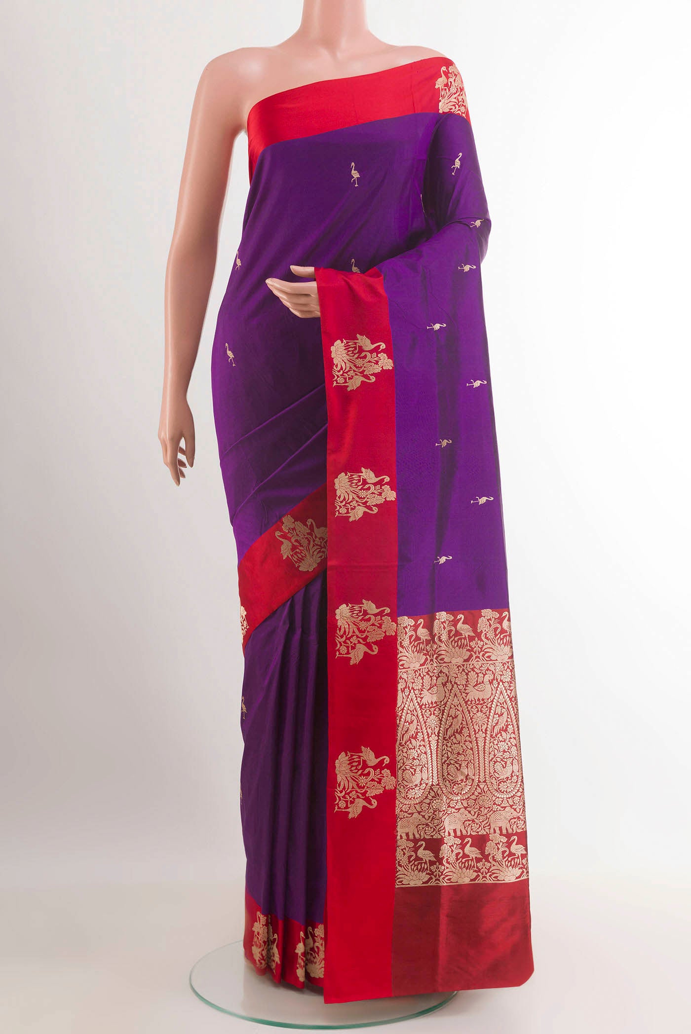 Purple Banarasi Katan Silk Saree with Zari Butta on the body and Zari Border.  displayed on a mannequin