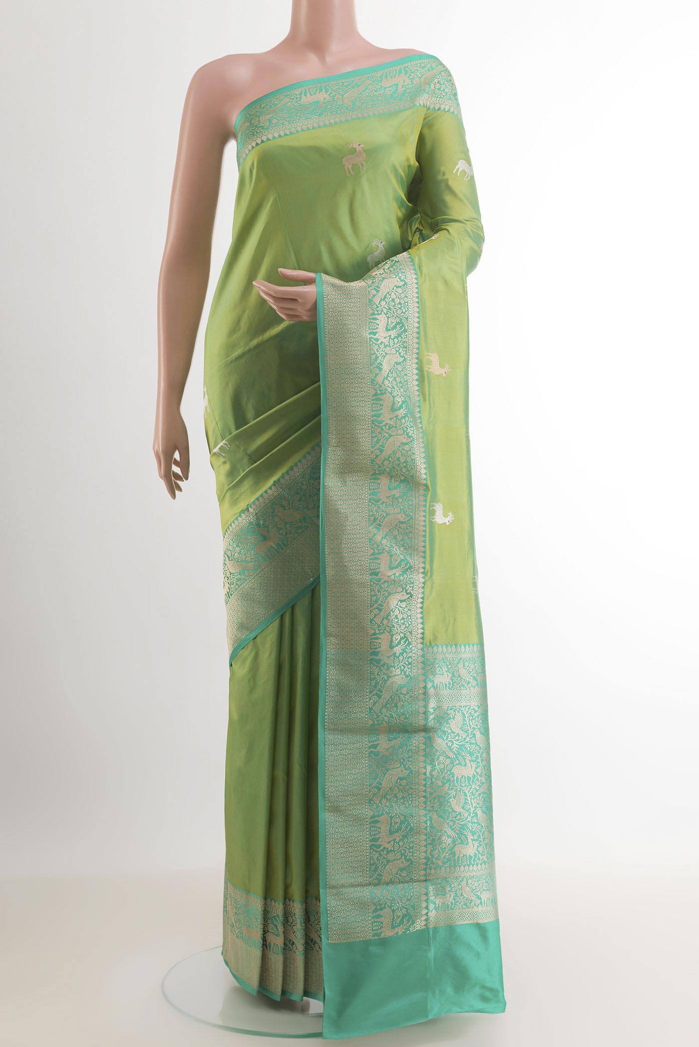 Light Green Dual Tone Banarasi Katan Silk Saree with Zari Butta on the body and Zari Border.  displayed on a mannequin