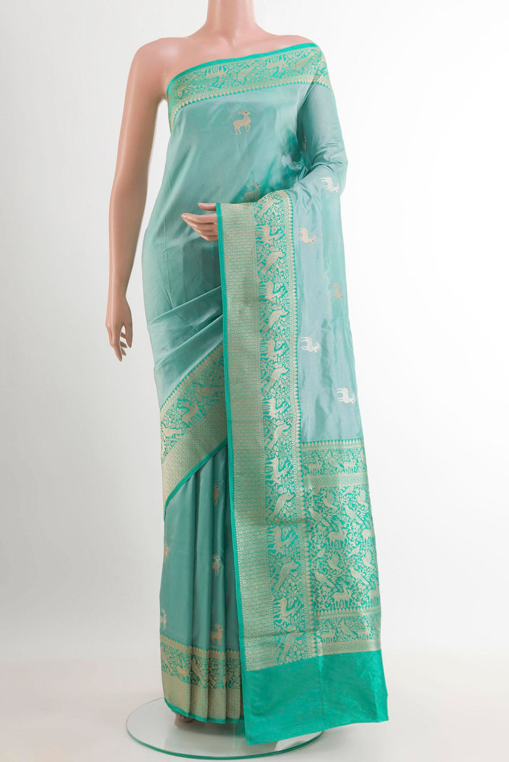 Blue Banarasi Katan Silk Saree with Zari Butta on the body and Zari Border.  displayed on a mannequin
