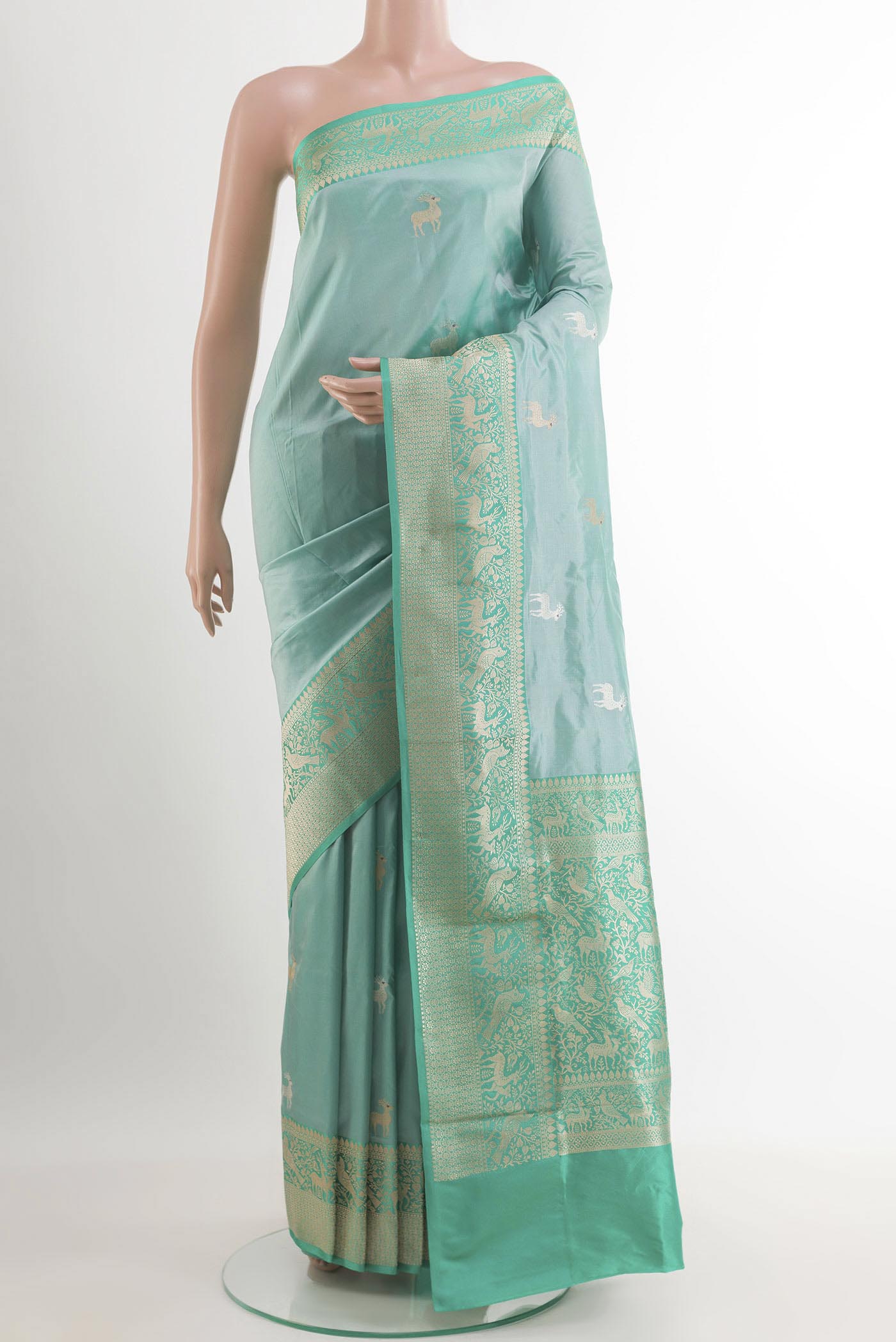 Blue Banarasi Katan Silk Saree with Zari Butta on the body and Zari Border.  displayed on a mannequin
