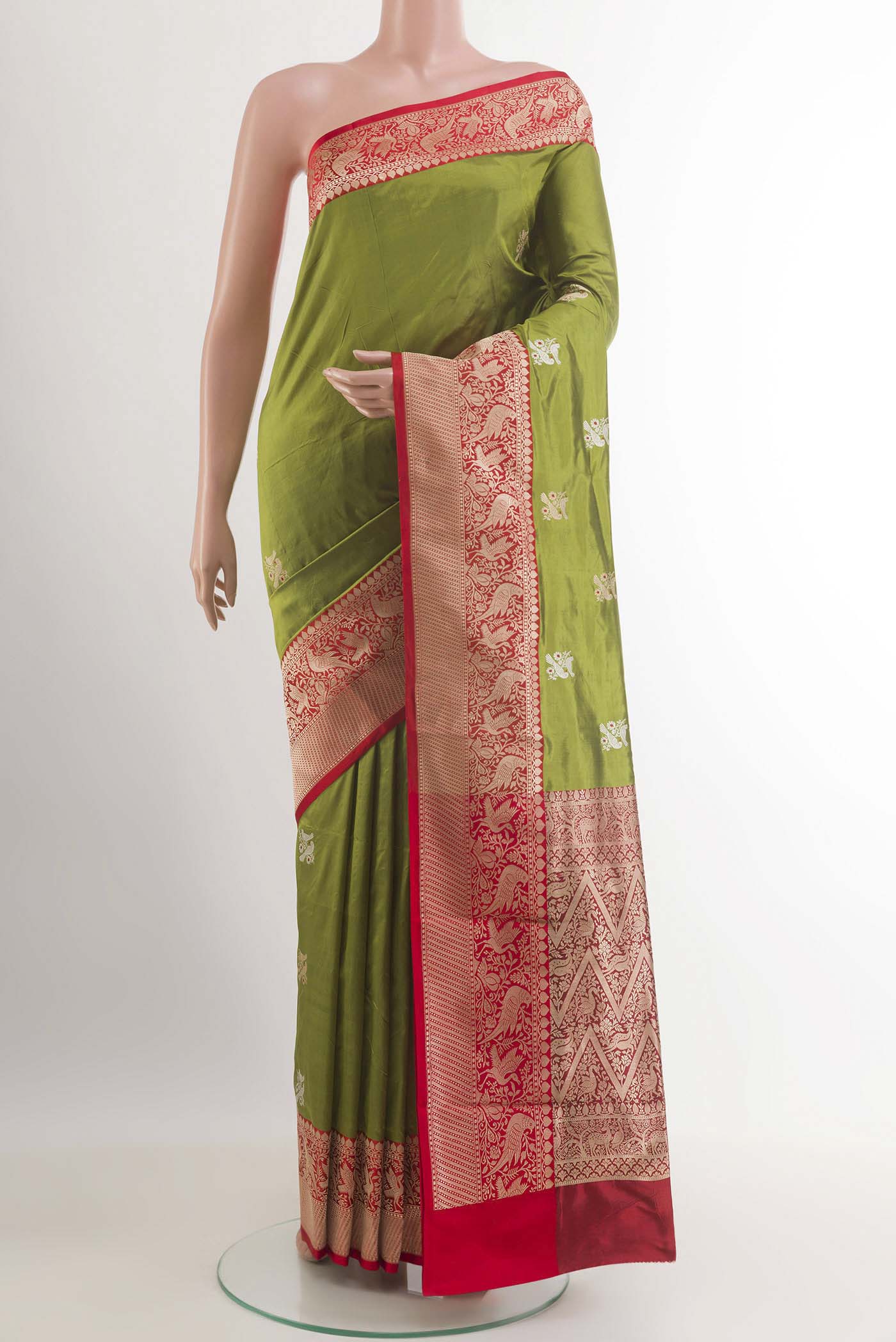 Green Banarasi Katan Silk Saree with Zari Butta on the body and Zari Border.  displayed on a mannequin