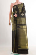 Black Kanchipuram Silk Saree with Zari Butta on the body and Zari Border.  displayed on a mannequin