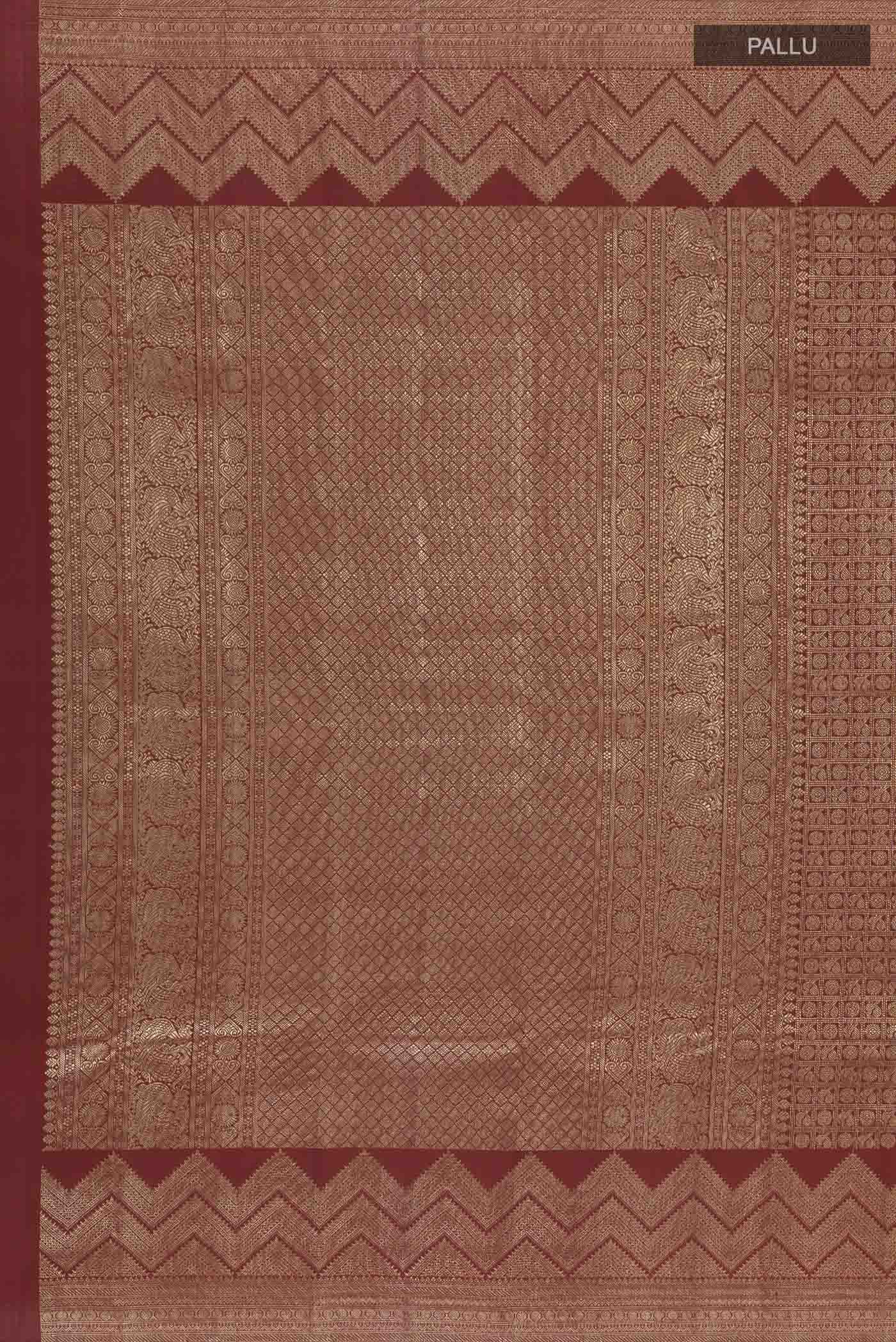 Close up image of the pallu of Maroon Kanchipuram Silk Saree with Zari Brocade on the body and Zari Border. 