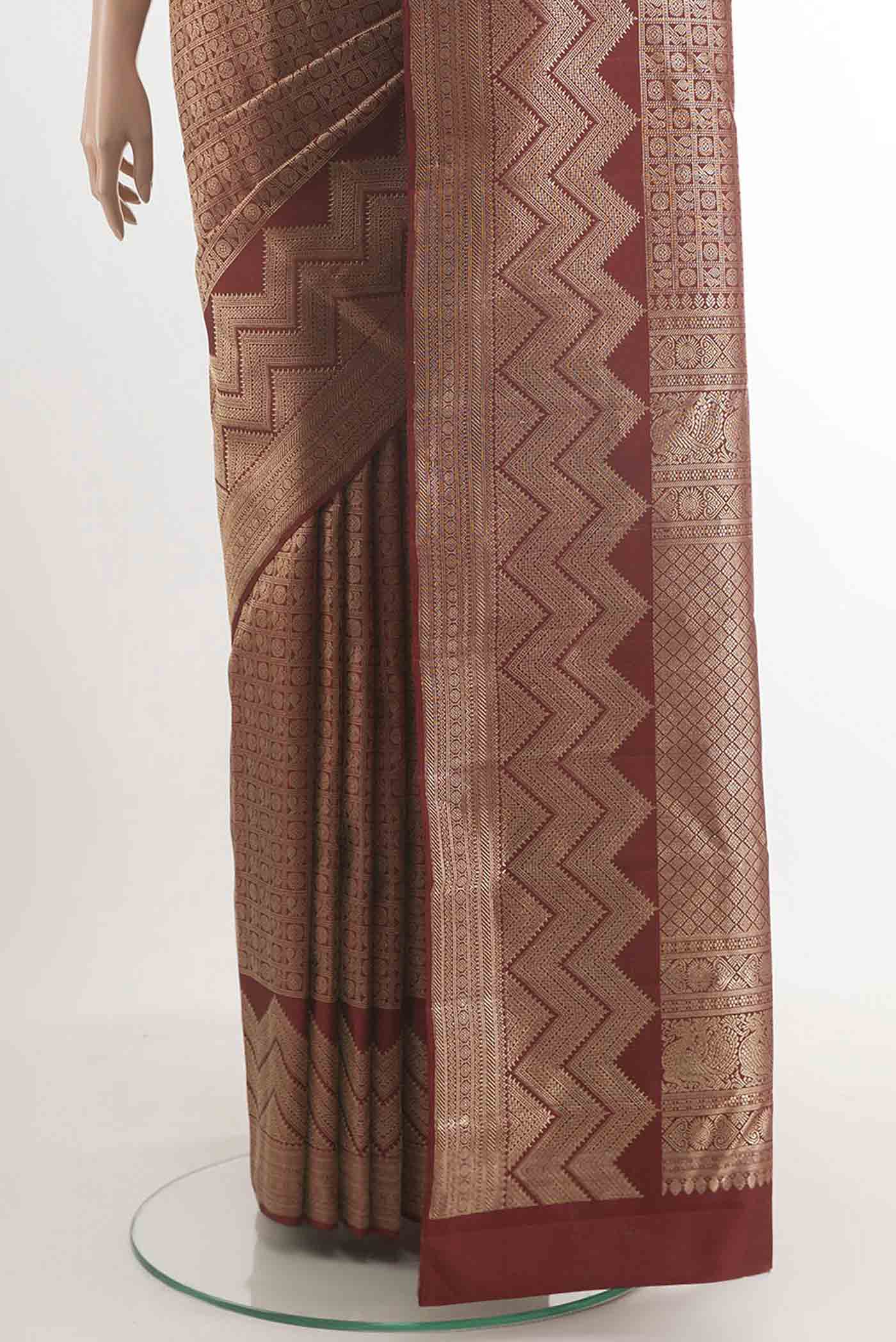 Pleats and pallu of Maroon Kanchipuram Silk Saree with Zari Brocade on the body and Zari Border. 