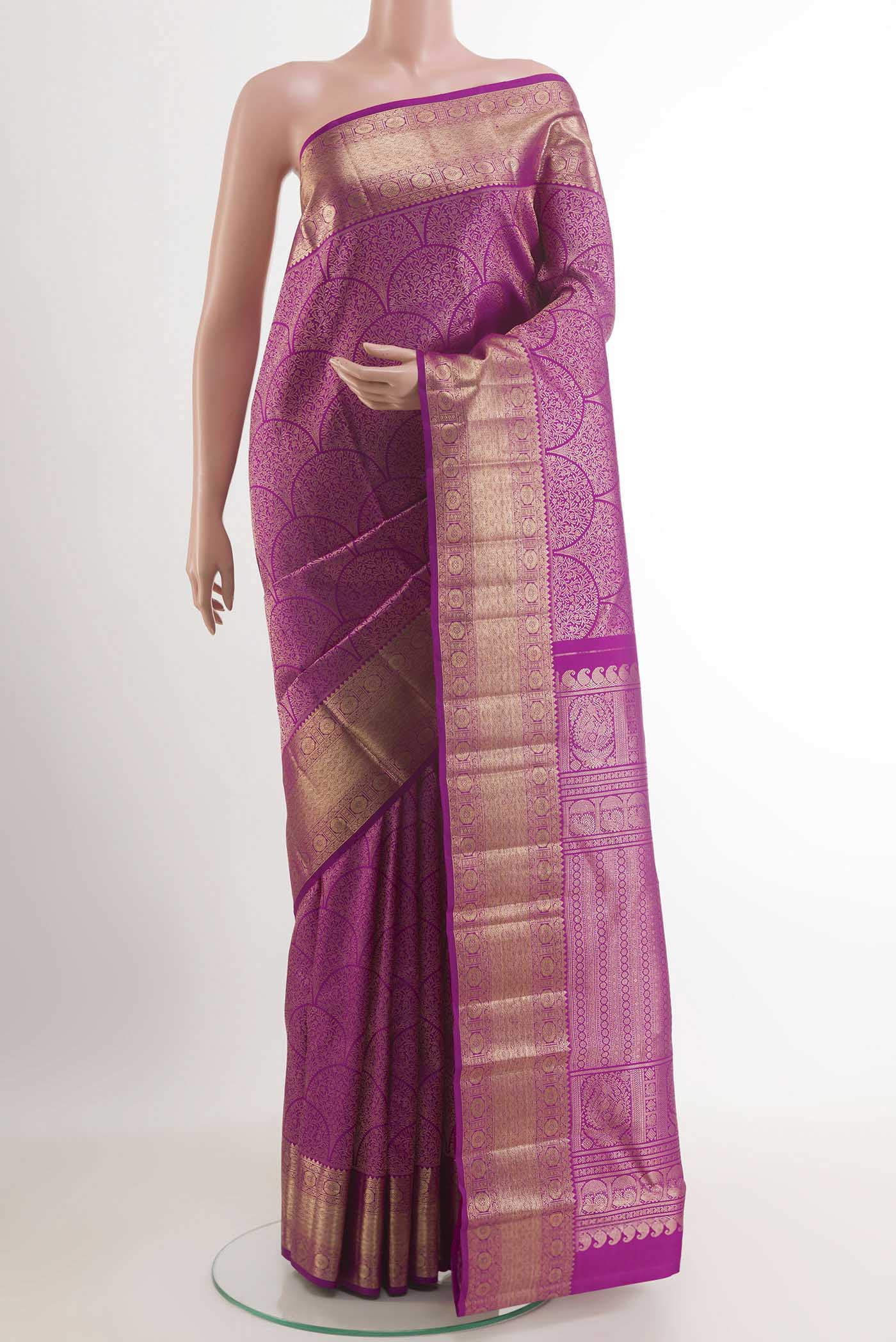 Purple Kanchipuram Silk Saree with Zari Brocade on the body and Zari Border.  displayed on a mannequin