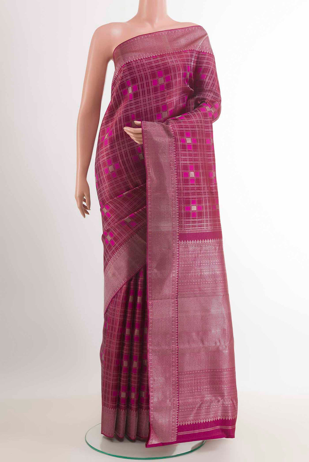 Purple Kanjivaram Silk Saree with Zari Brocade on the body and Ganga Jamuna Border.  displayed on a mannequin
