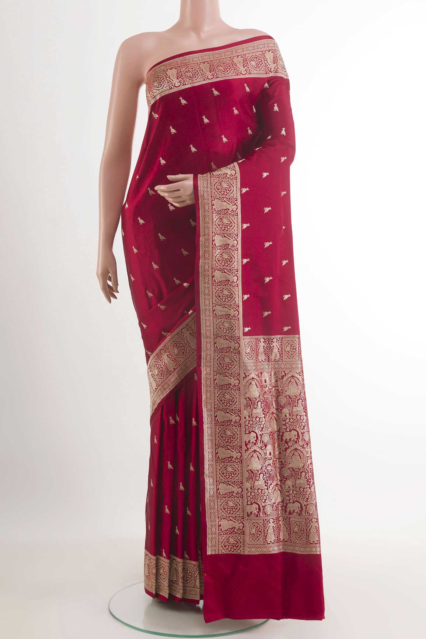 Red Banarasi Silk Saree with Zari Butta on the body and Zari Border.  displayed on a mannequin