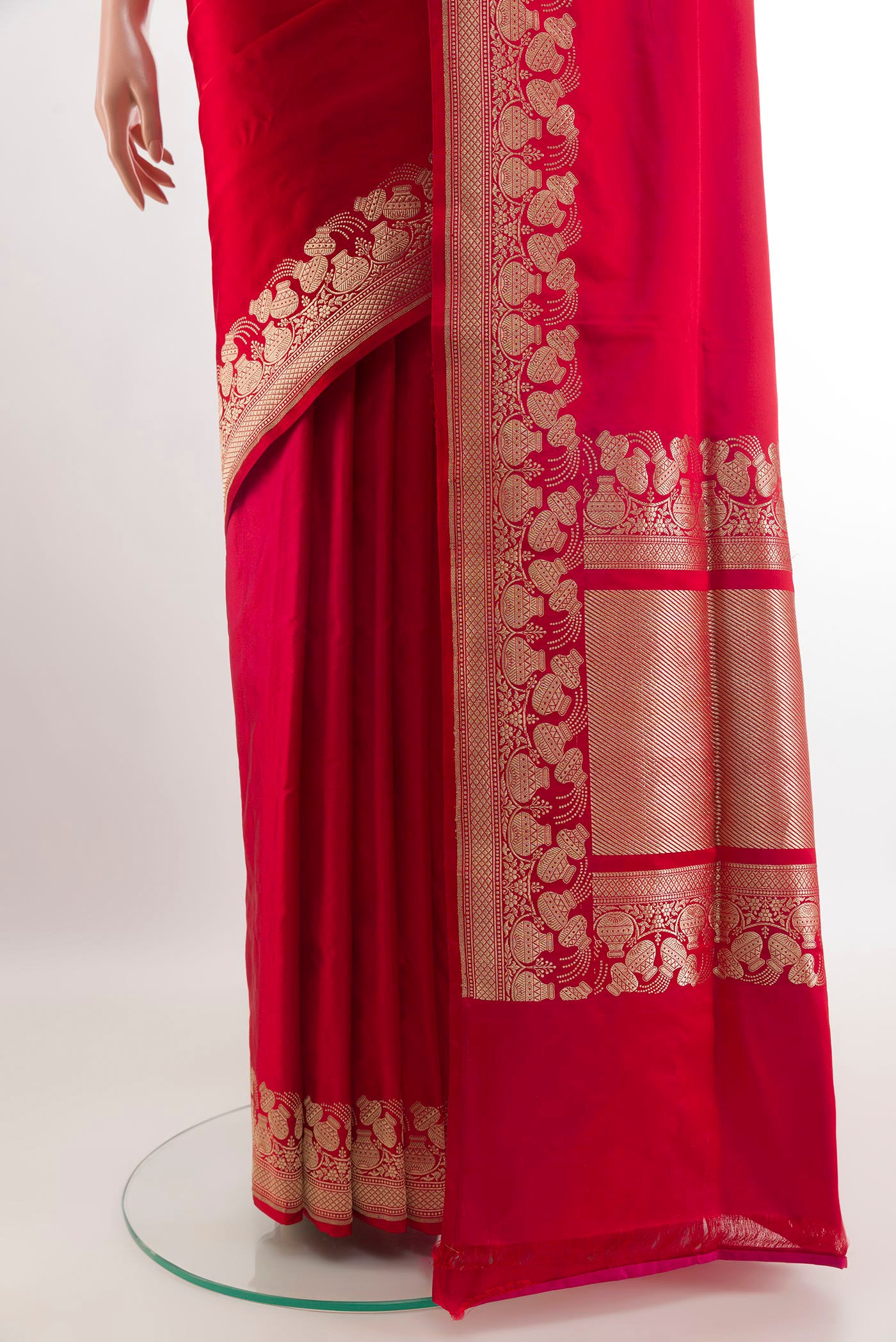 Pleats and pallu of Red Banarasi Silk Saree with Plain Body and Zari Border. 