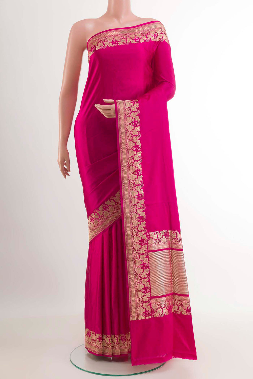 Pink Banarasi Saree with Plain Body and Zari Border.  displayed on a mannequin