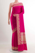 Pink Banarasi Saree with Plain Body and Zari Border.  displayed on a mannequin