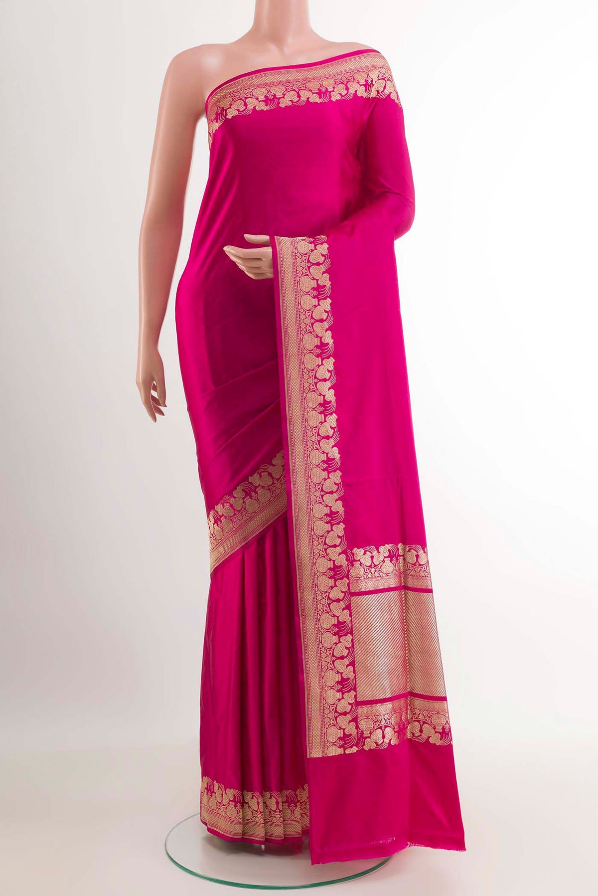 Pink Banarasi Saree with Plain Body and Zari Border.  displayed on a mannequin