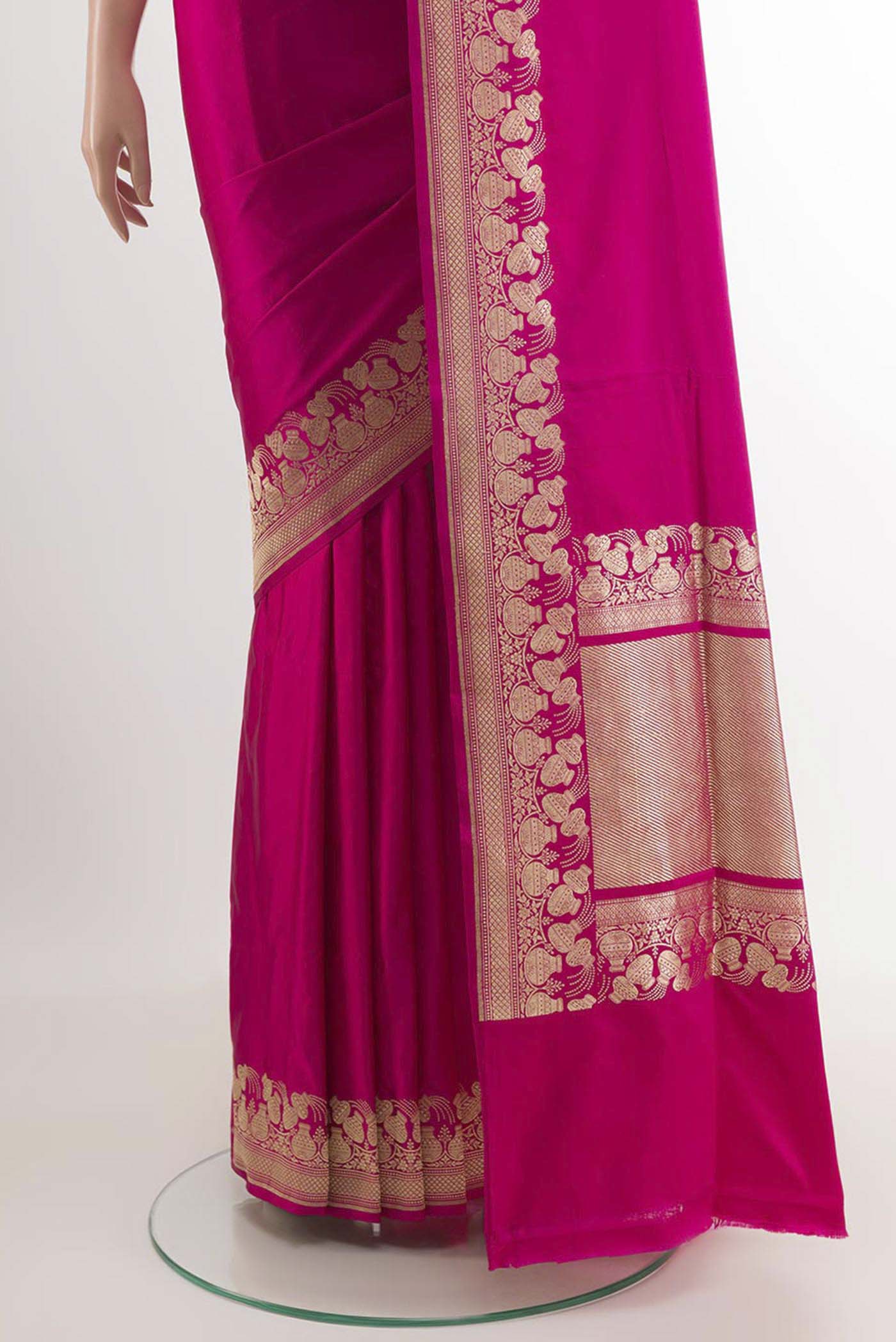 Pleats and pallu of Pink Banarasi Saree with Plain Body and Zari Border. 