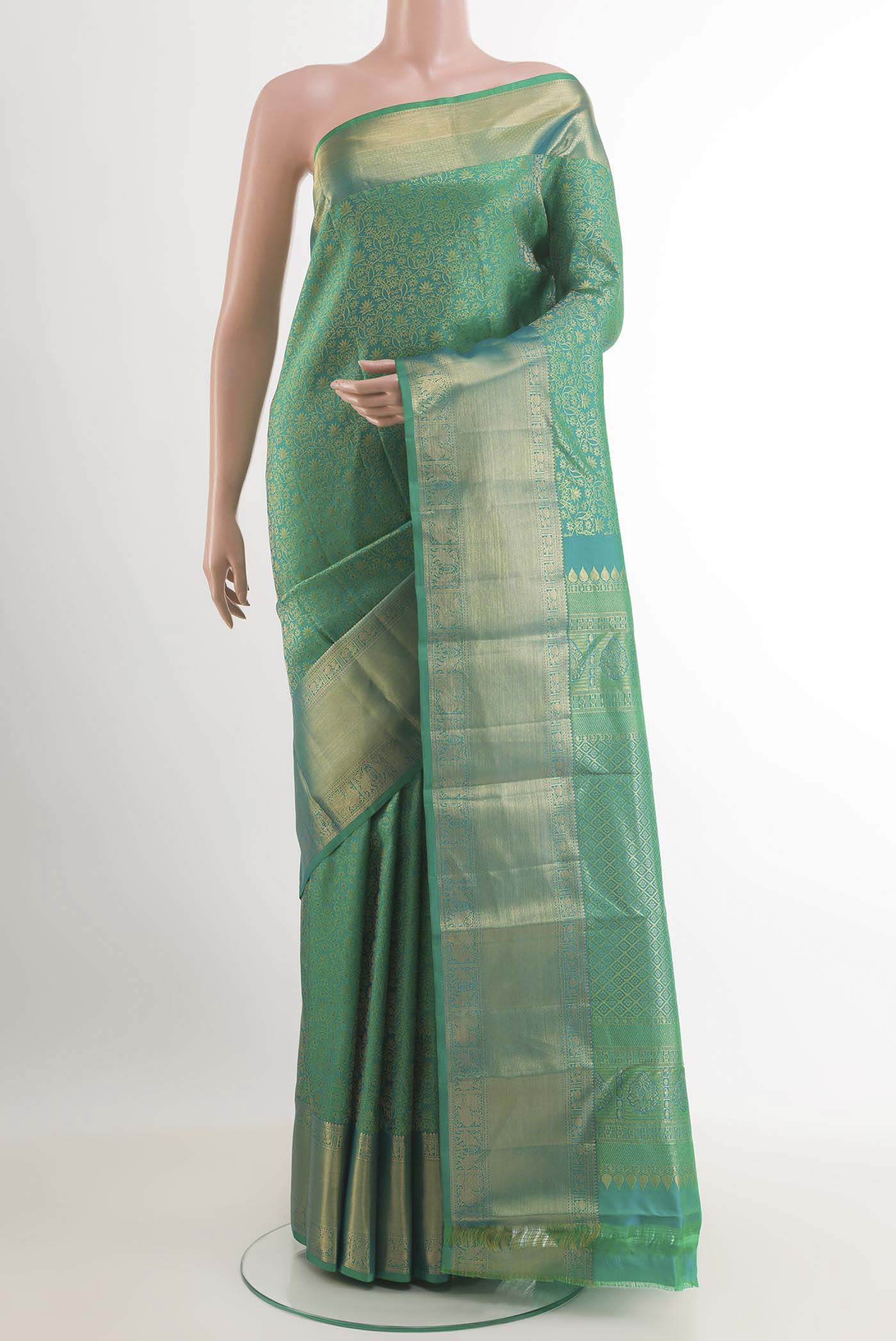 Sea Green Kanchipuram Silk Saree with Zari Brocade on the body and Zari Border.  displayed on a mannequin