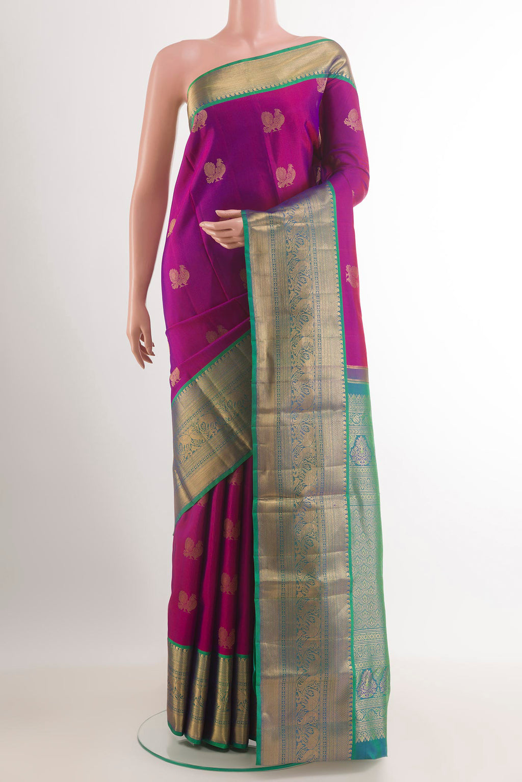 Purple Kanchipuram Silk Saree with Jacquard design on the body and Zari Border.  displayed on a mannequin