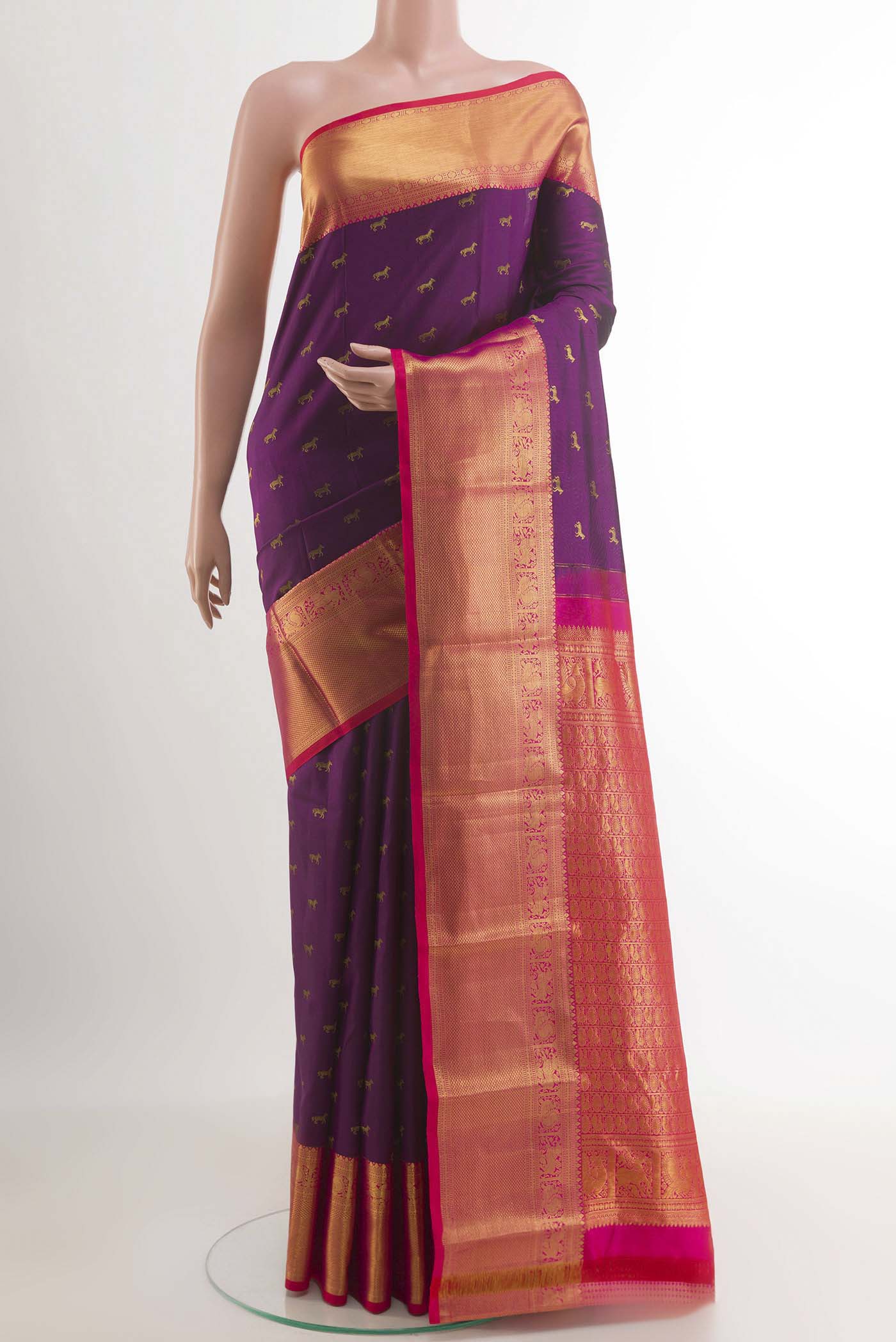 Purple Kanchipuram Silk Saree with Zari Butta on the body and Zari Border.  displayed on a mannequin